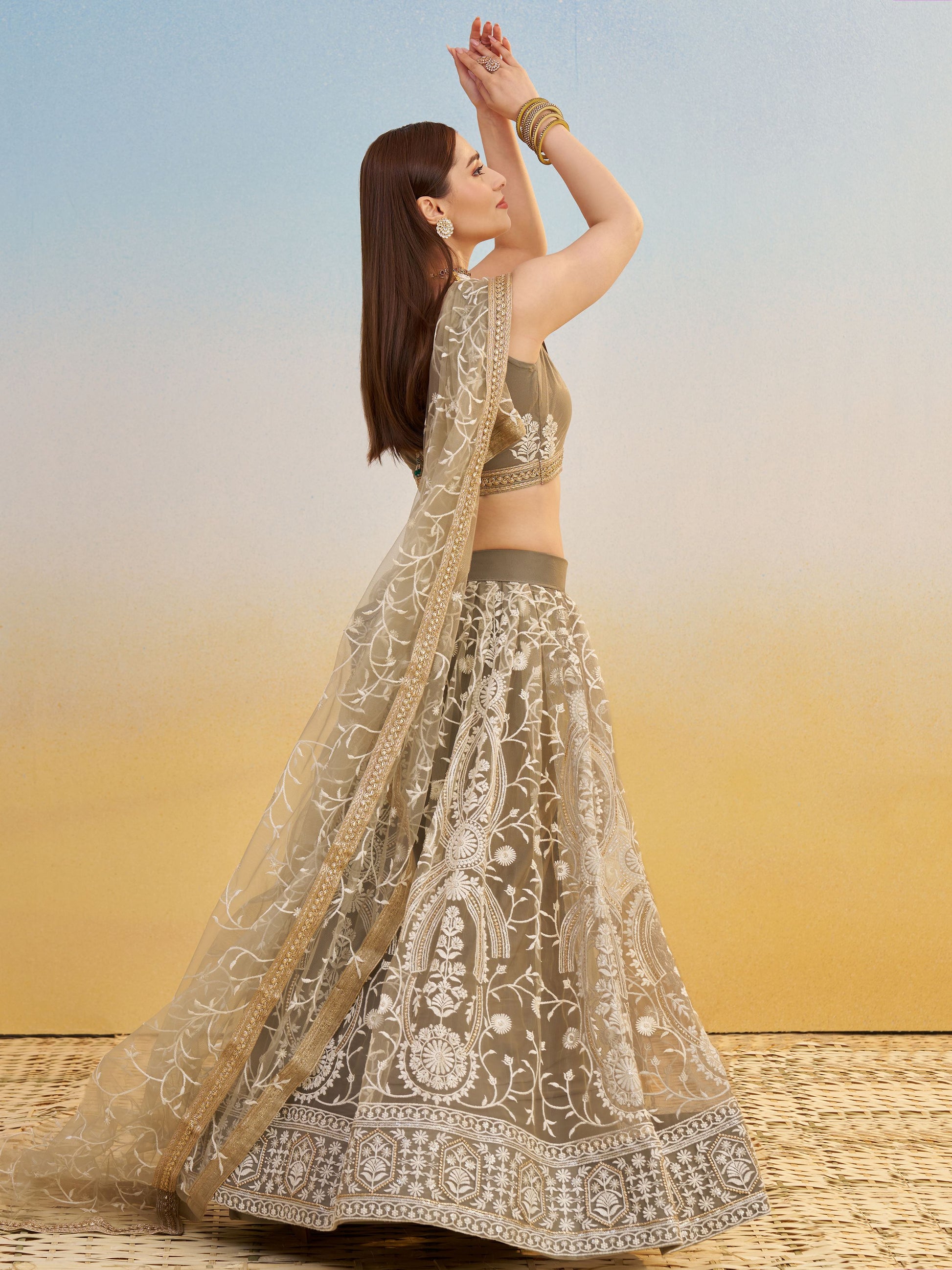 Elegant Brown Embroidered Net Wedding Wear Lehenga Choli With Dupatta