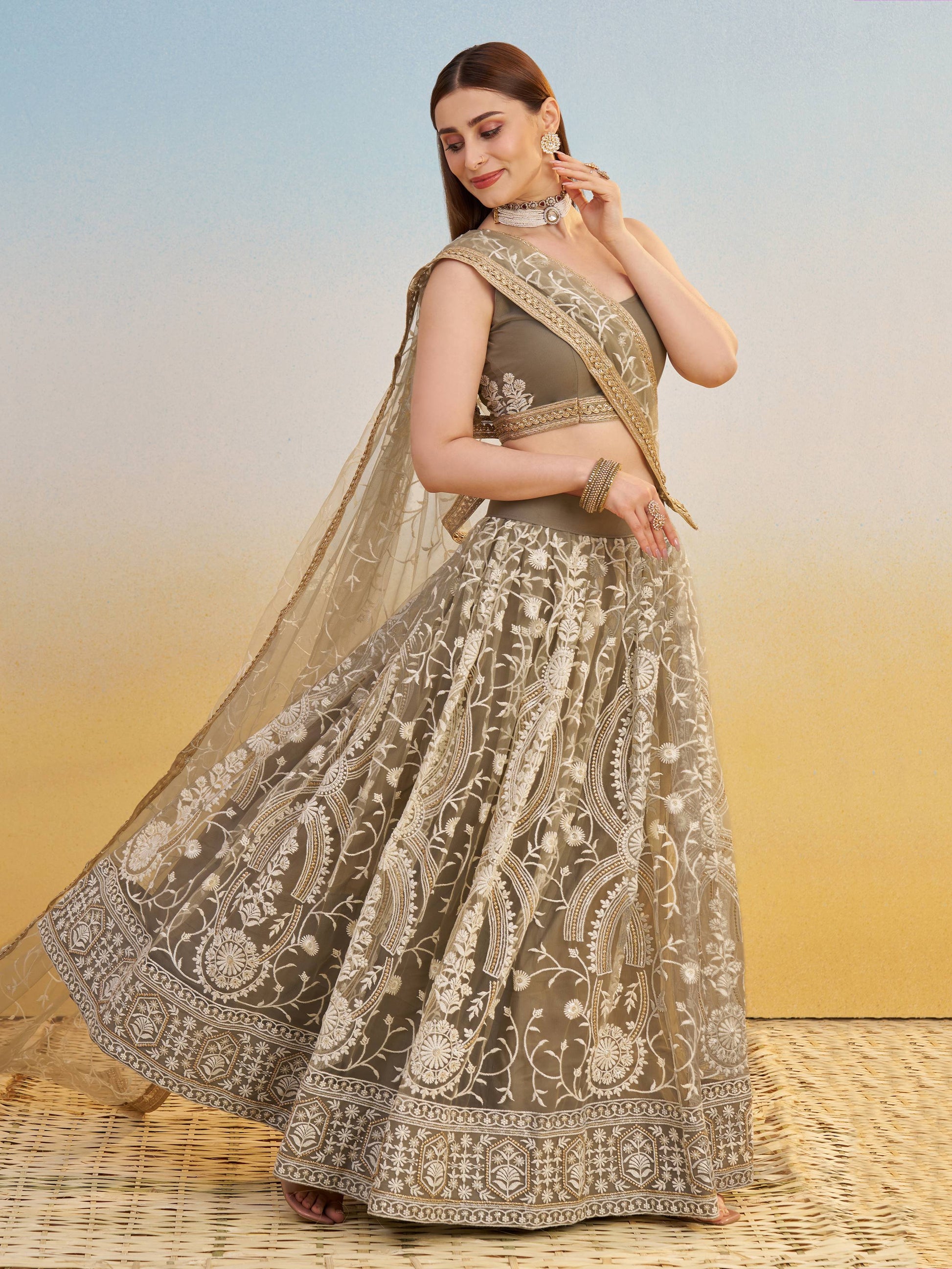 Elegant Brown Embroidered Net Wedding Wear Lehenga Choli With Dupatta