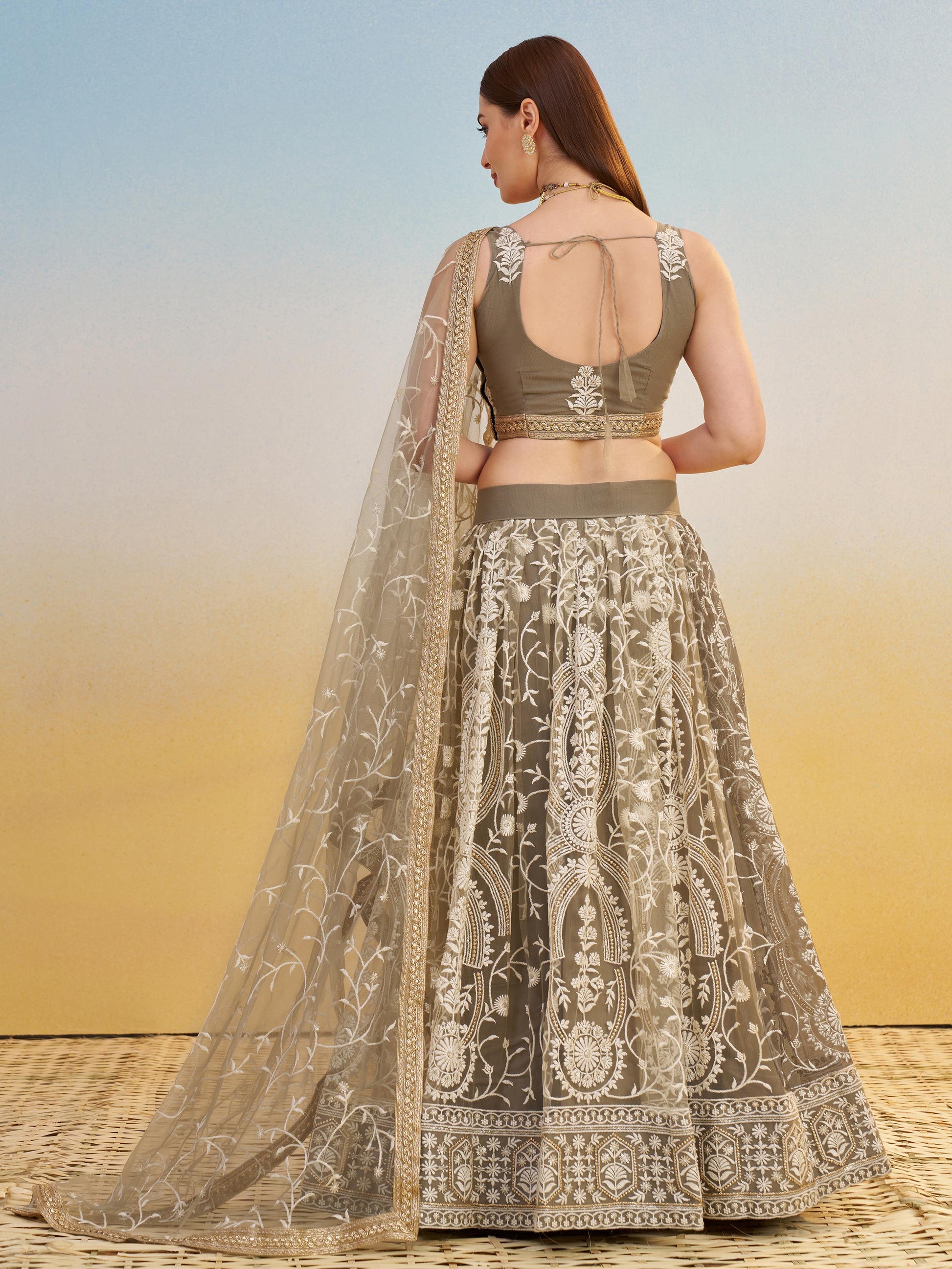 Elegant Brown Embroidered Net Wedding Wear Lehenga Choli With Dupatta