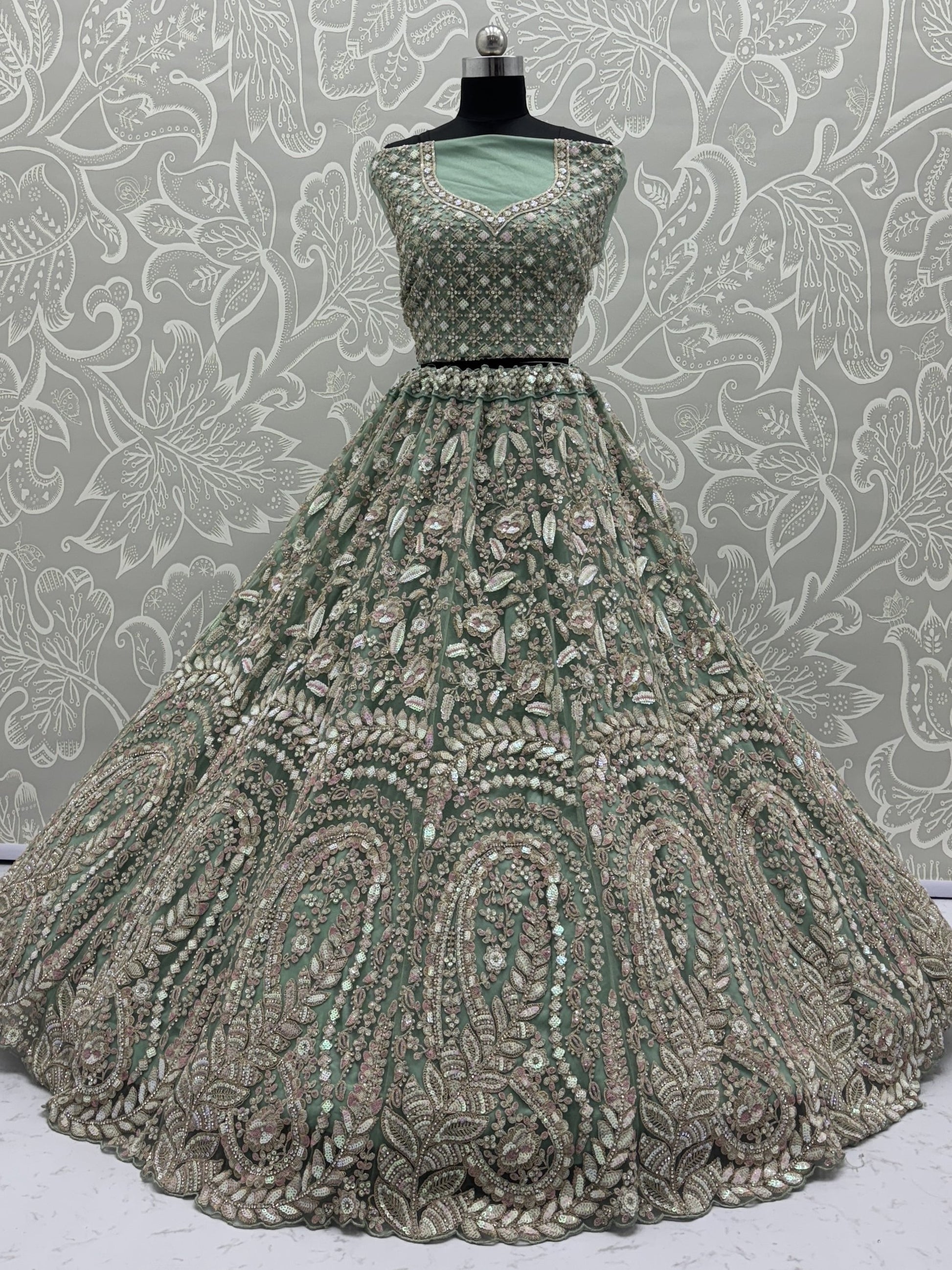 Enchanting Pista Green Sequins Net Reception Wear Lehenga Choli With Dupatta
