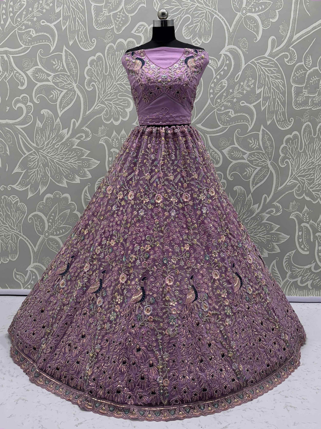 Astonishing Purple Zari Embroidered Net Engagement Wear Lehenga Choli