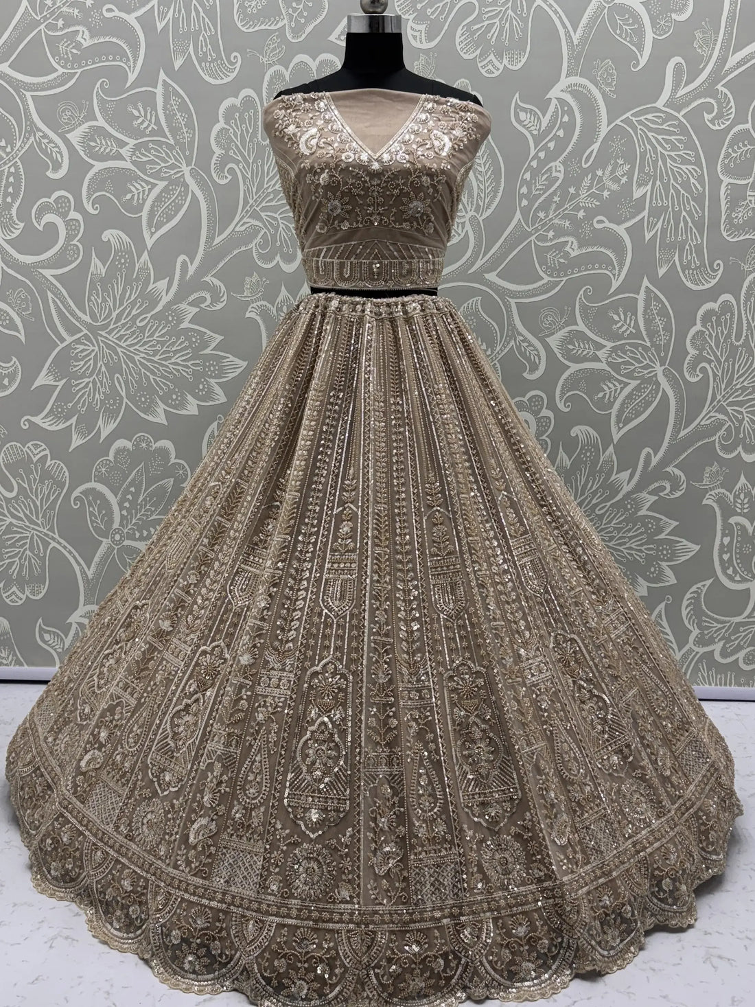 Enchanting Beige Embroidered Net Wedding Wear Lehenga Choli With Dupatta