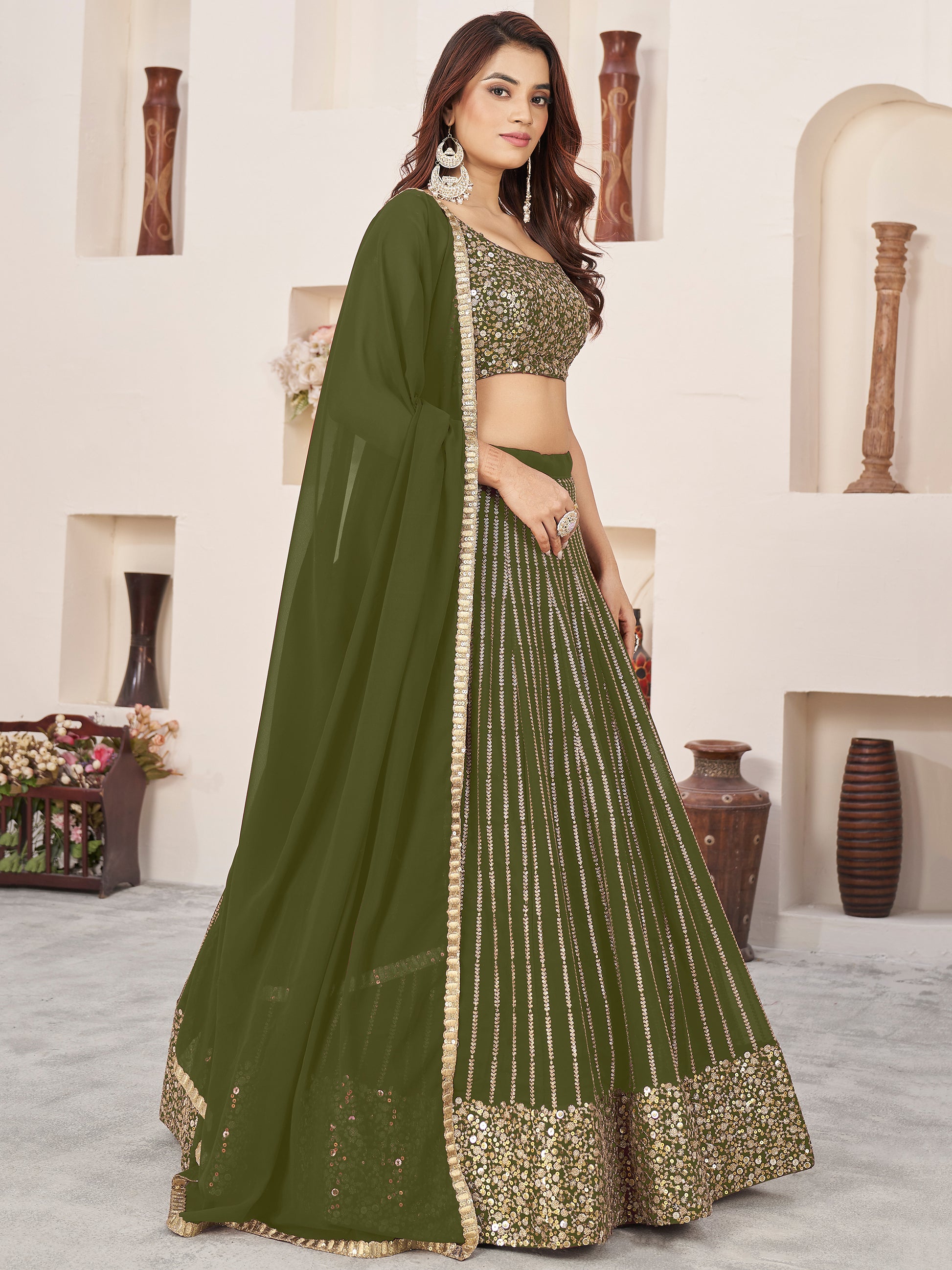 Outstanding Green Sequins Georgette Mehendi Wear Lehenga Choli