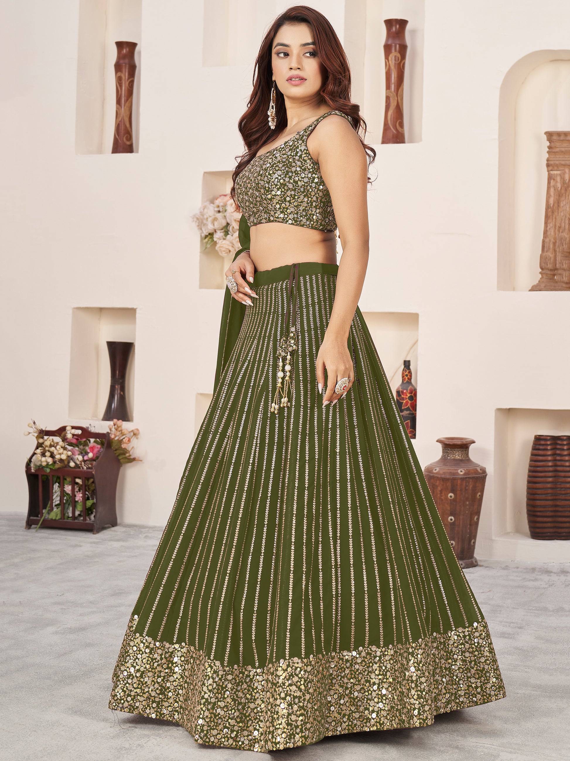 Outstanding Green Sequins Georgette Mehendi Wear Lehenga Choli