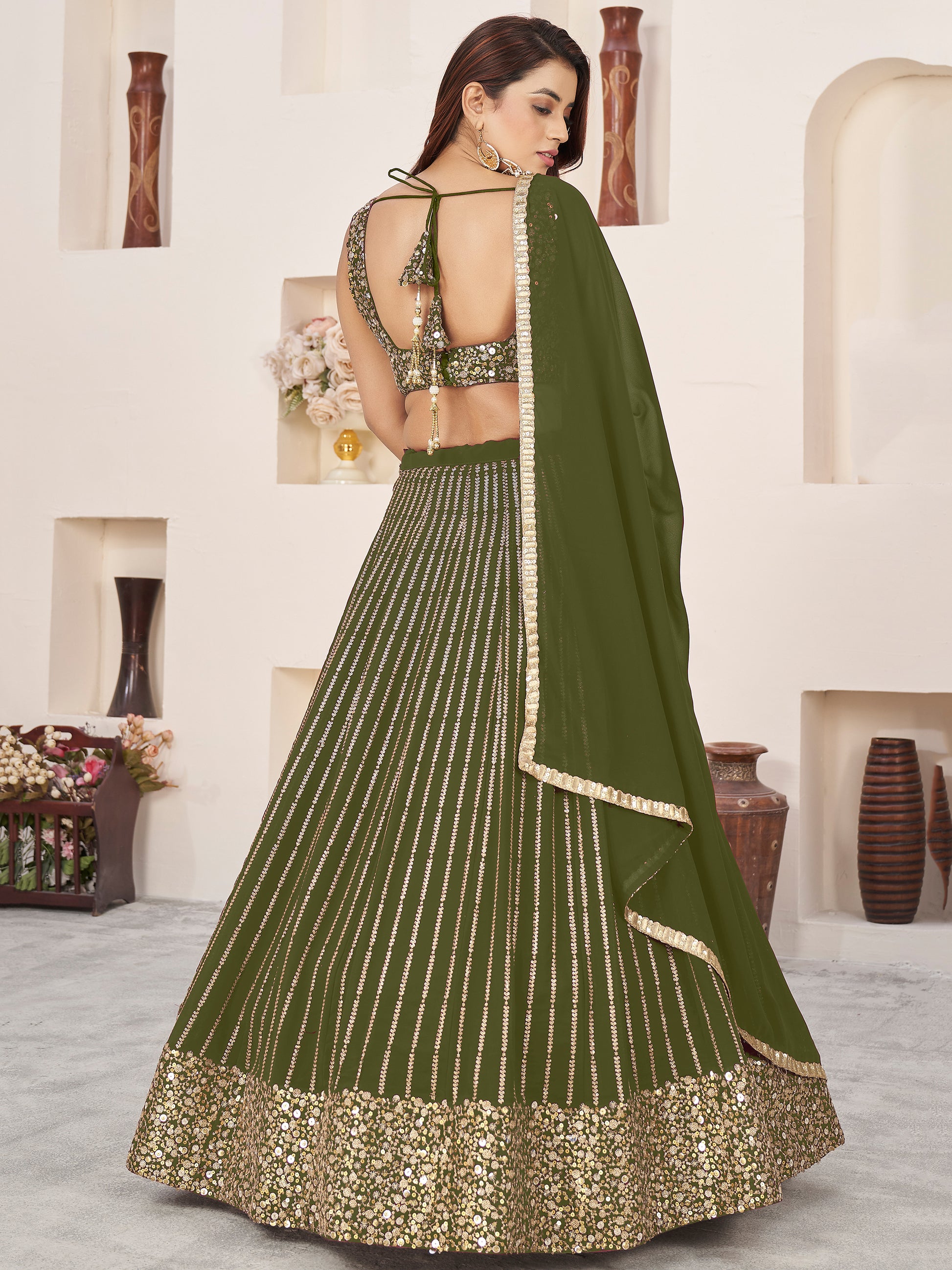 Outstanding Green Sequins Georgette Mehendi Wear Lehenga Choli
