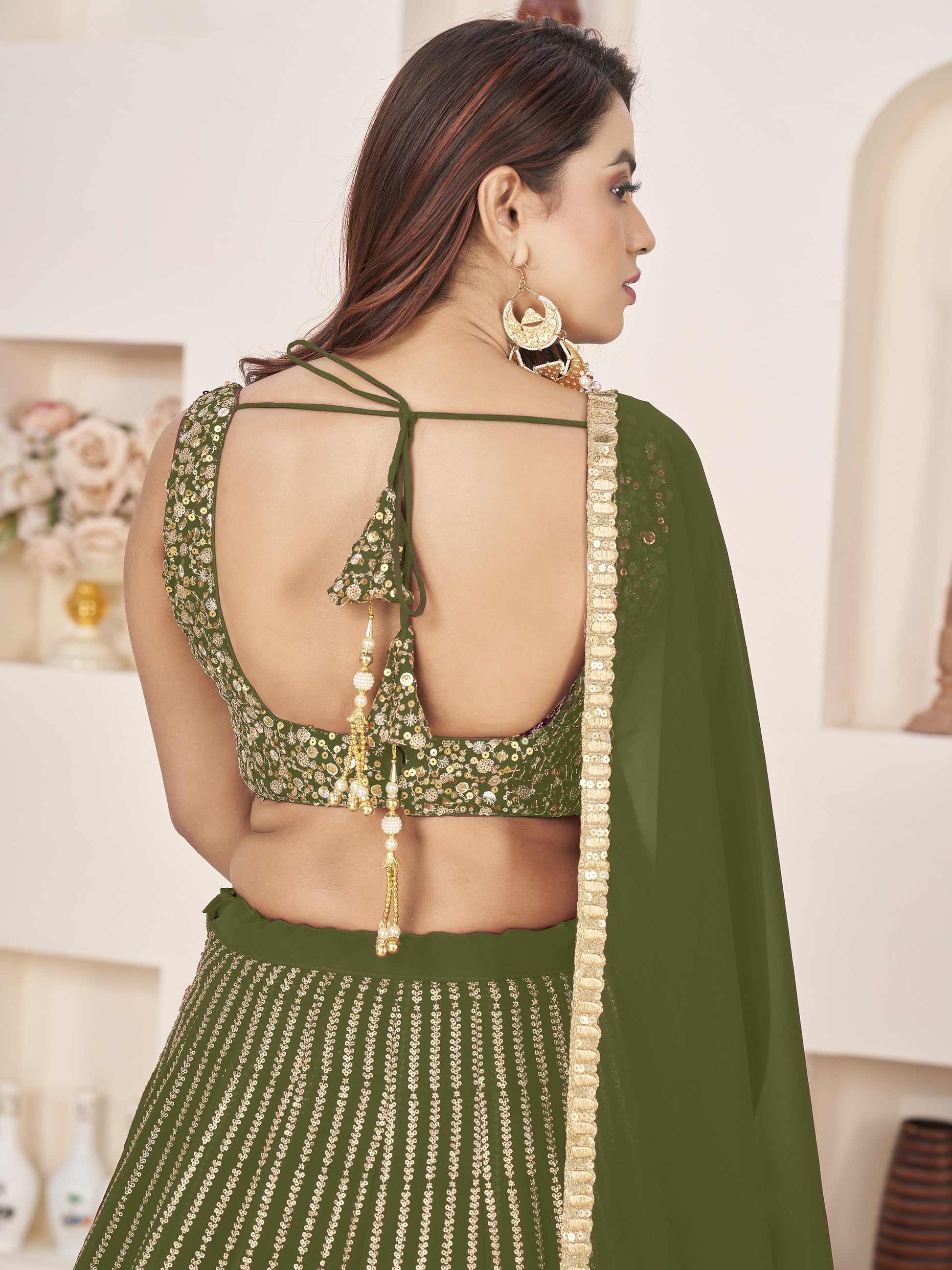 Outstanding Green Sequins Georgette Mehendi Wear Lehenga Choli