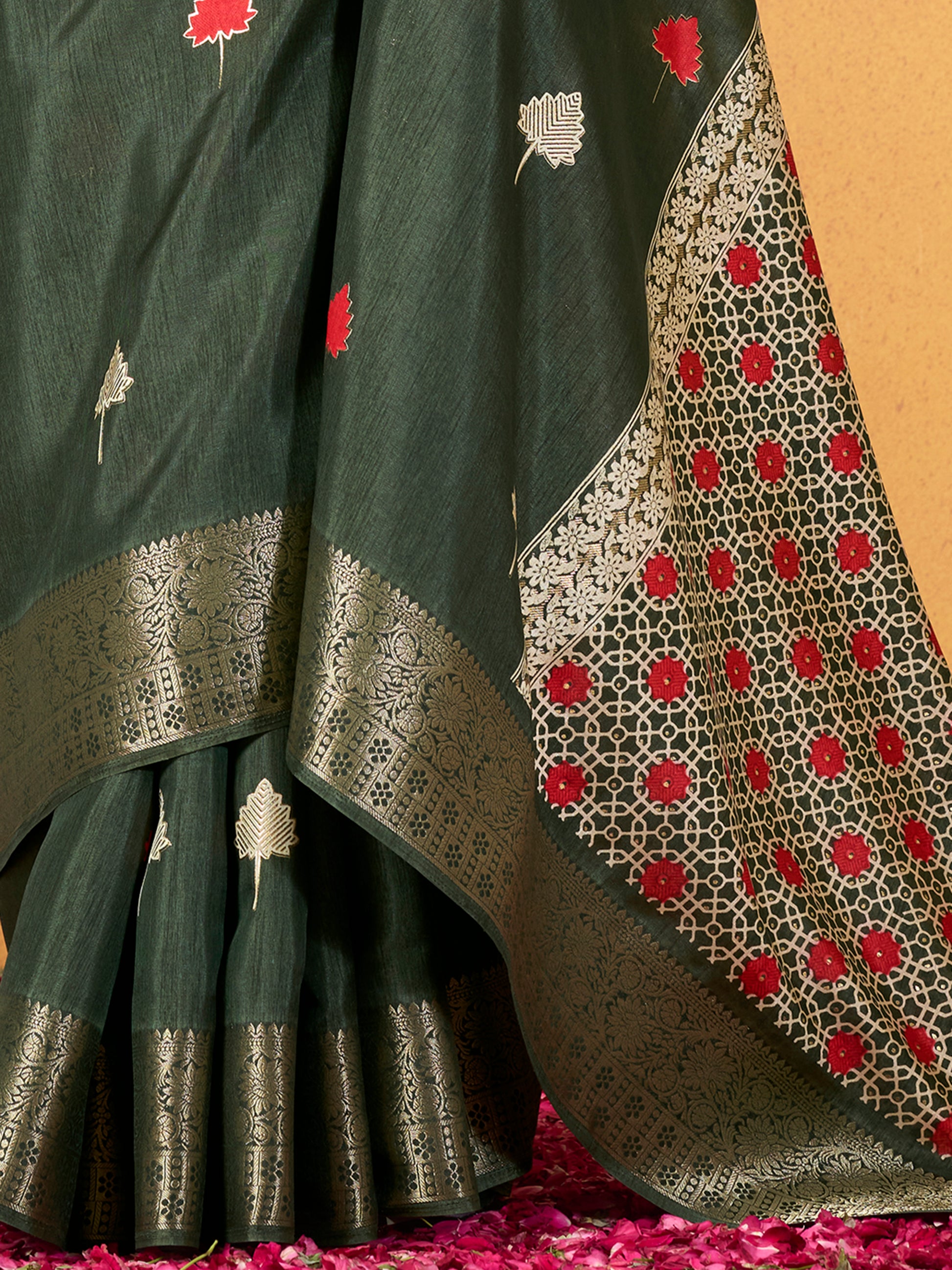 Make your upcoming celebrations truly special with this stunning green dola silk saree. The saree features a harmonious blend of foil print and zari weaving, adding a touch of sophistication and texture to its vibrant green hue. With its intricate detailing and elegant design, this saree is perfect for festivals, events, and any occasion where you wish to make a memorable impression. Complementing the saree is a matching unstitched silk blouse, adorned with the same foil print and zari work. Measuring 5.50