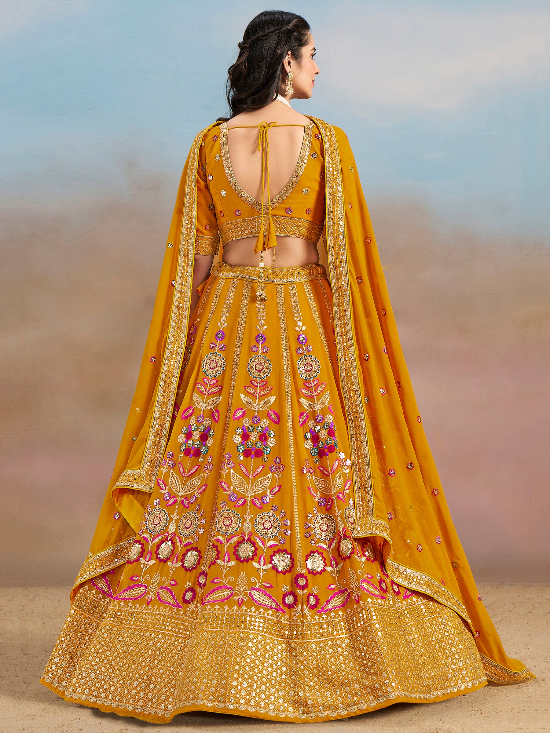 Pretty Yellow Thread Embroidered Georgette Haldi Wear Lehenga Choli