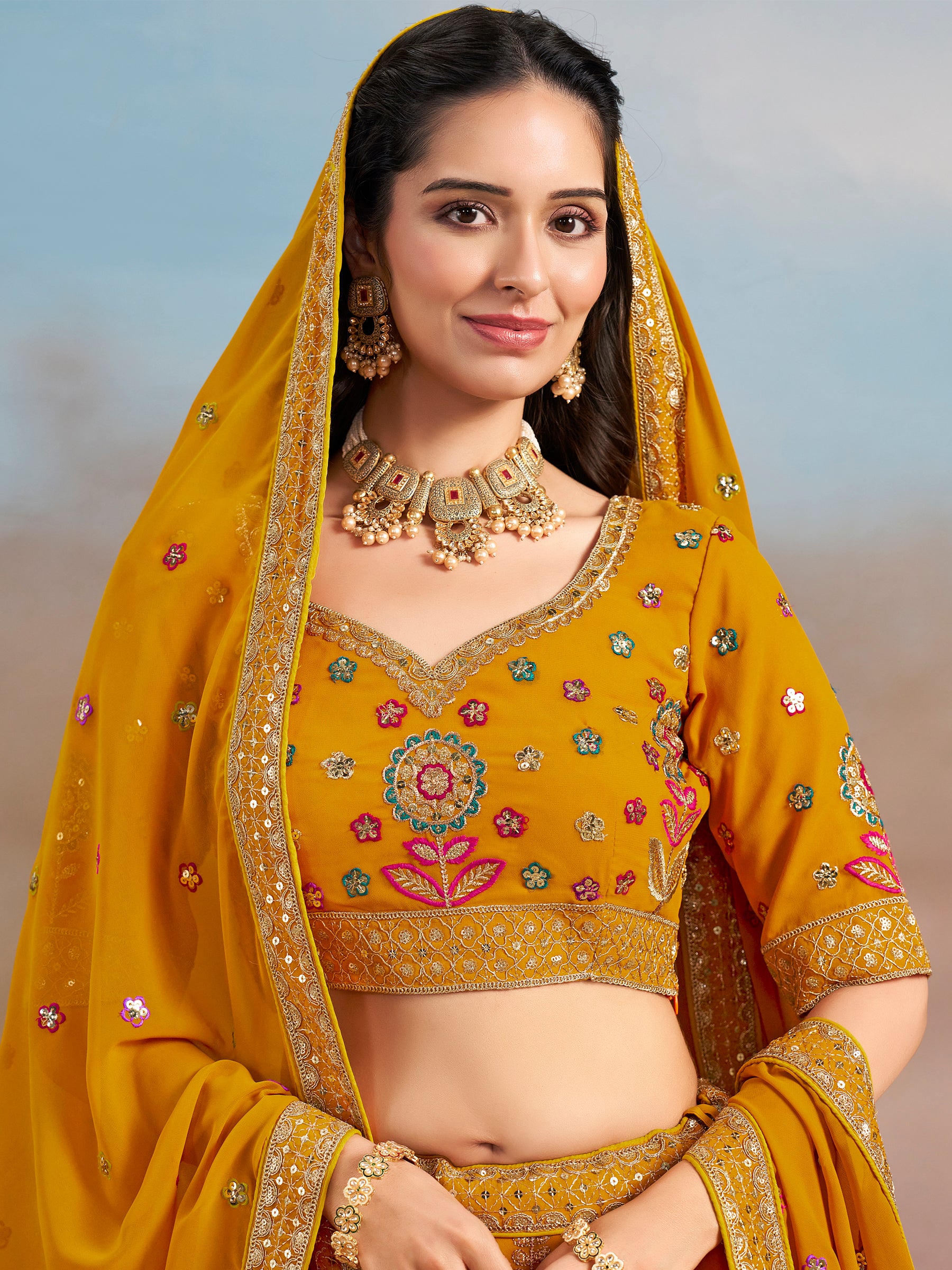 Pretty Yellow Thread Embroidered Georgette Haldi Wear Lehenga Choli
