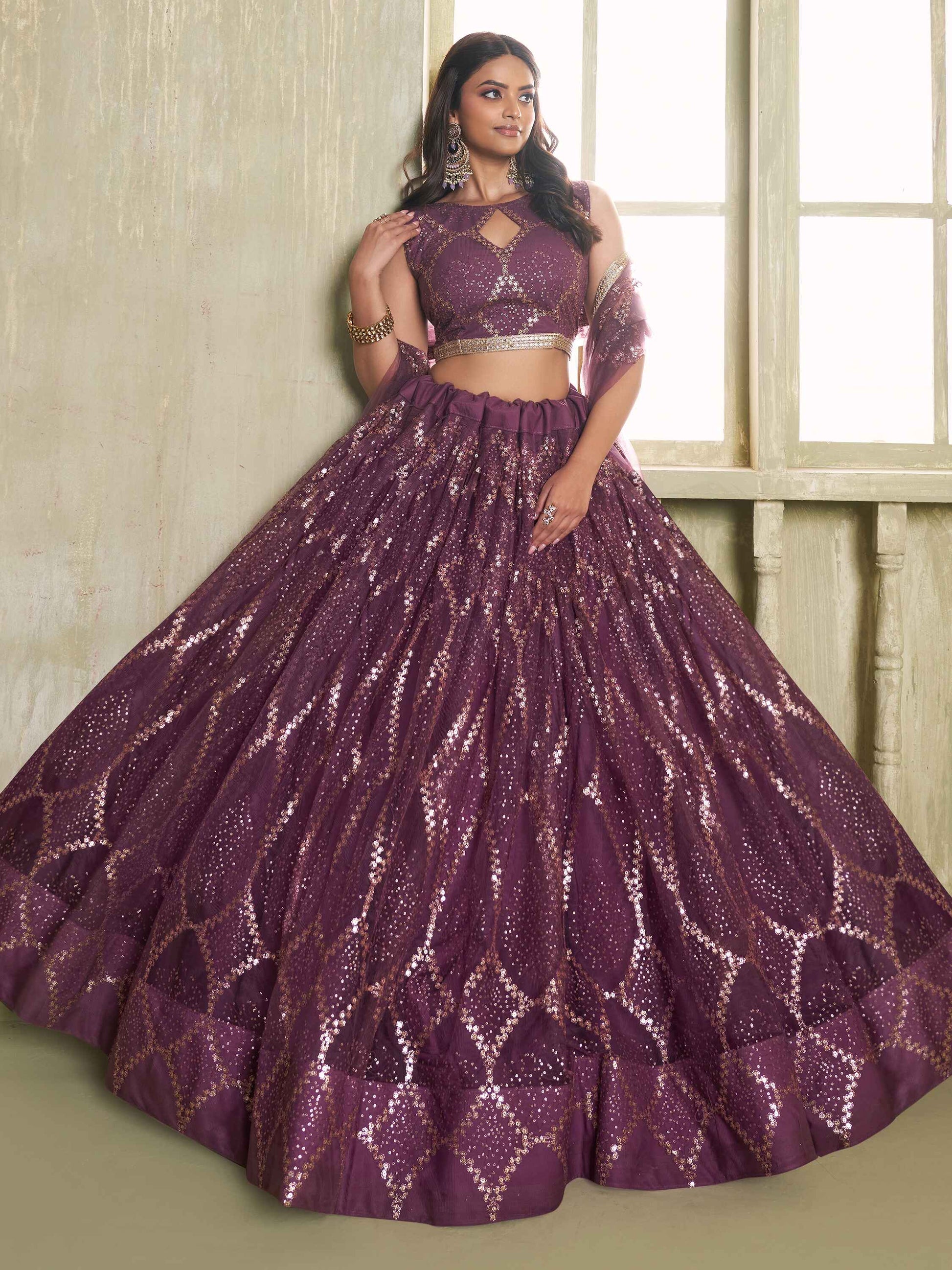 Attractive Wine Sequins Net Party Wear Lehenga Choli With Dupatta