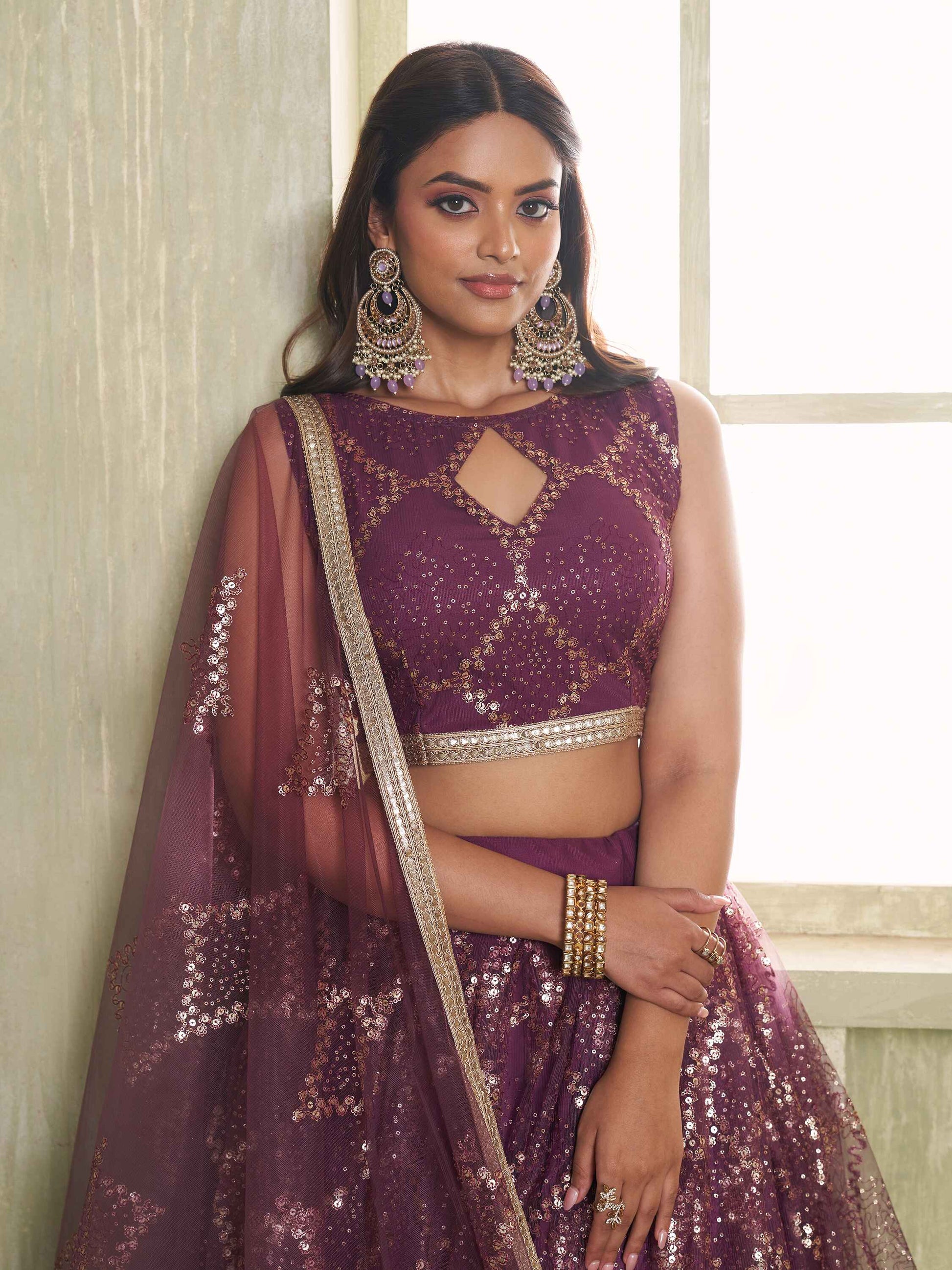 Attractive Wine Sequins Net Party Wear Lehenga Choli With Dupatta