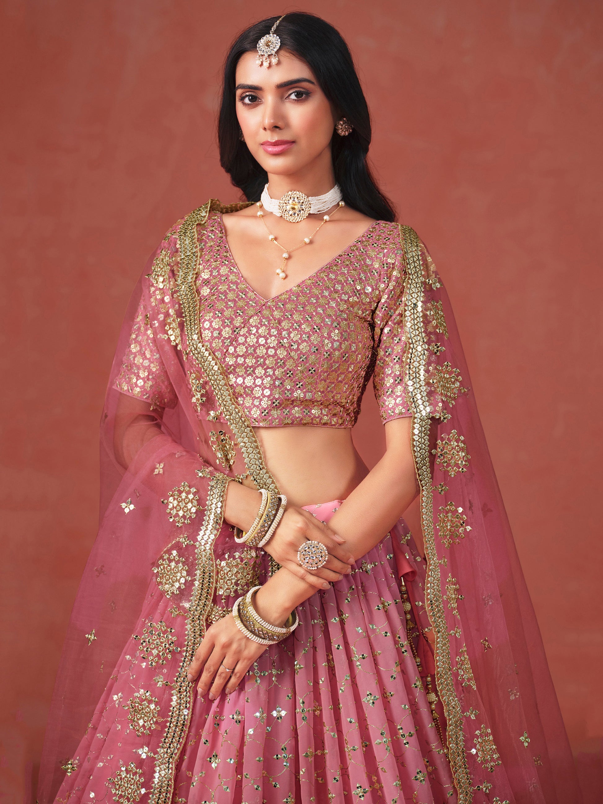 Fabulous Peach Georgette Embroidered Zari Lehenga Choli With Dupatta