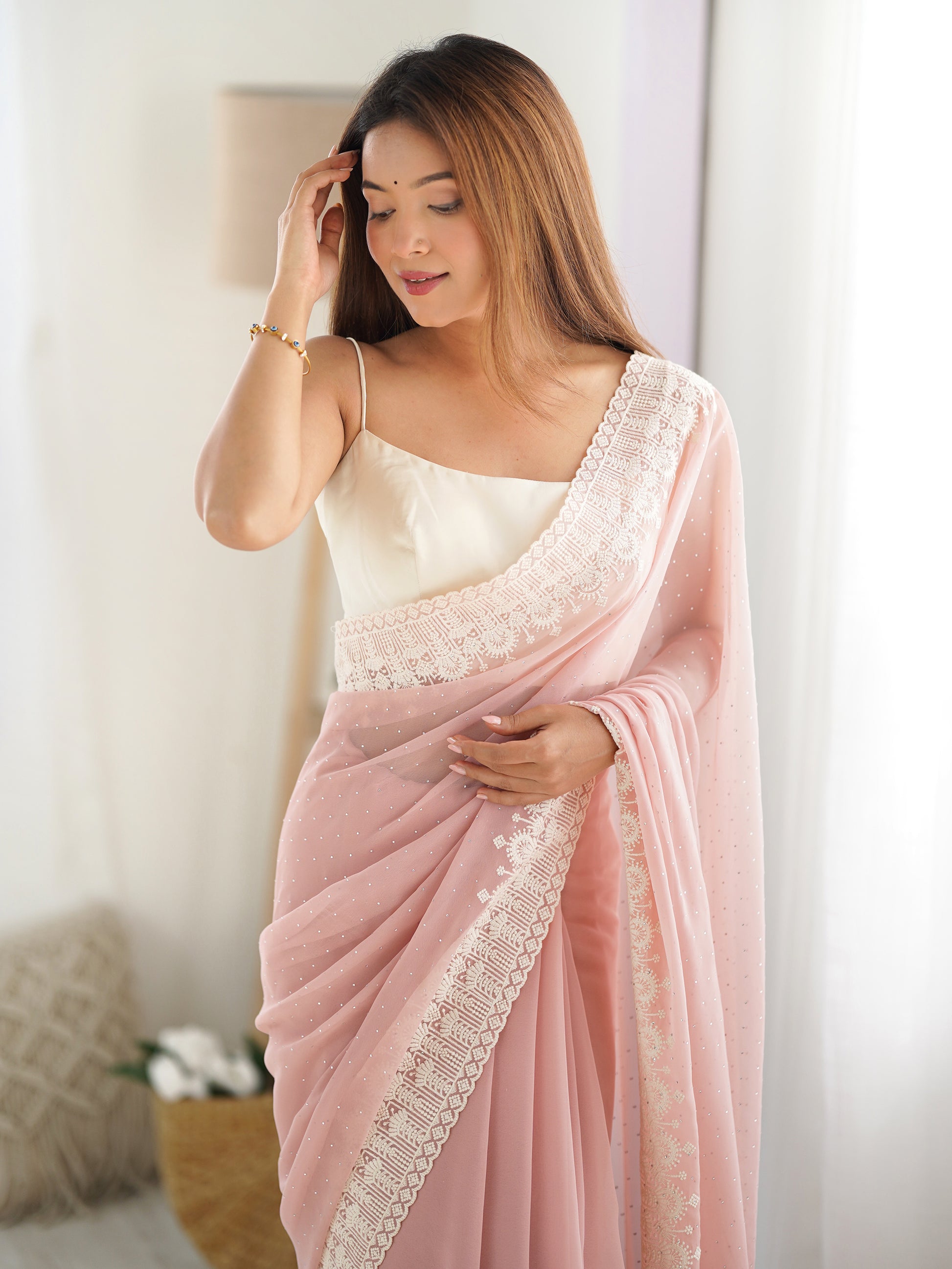 Dazzling Peach Stone Work Georgette Party Wear Saree With Blouse