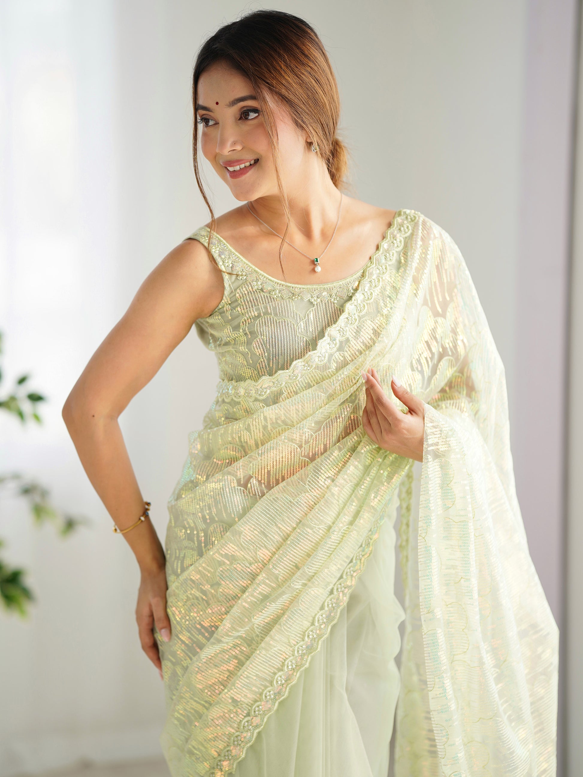 Attractive Pista Green Sequins Net Festival Wear Saree With Blouse