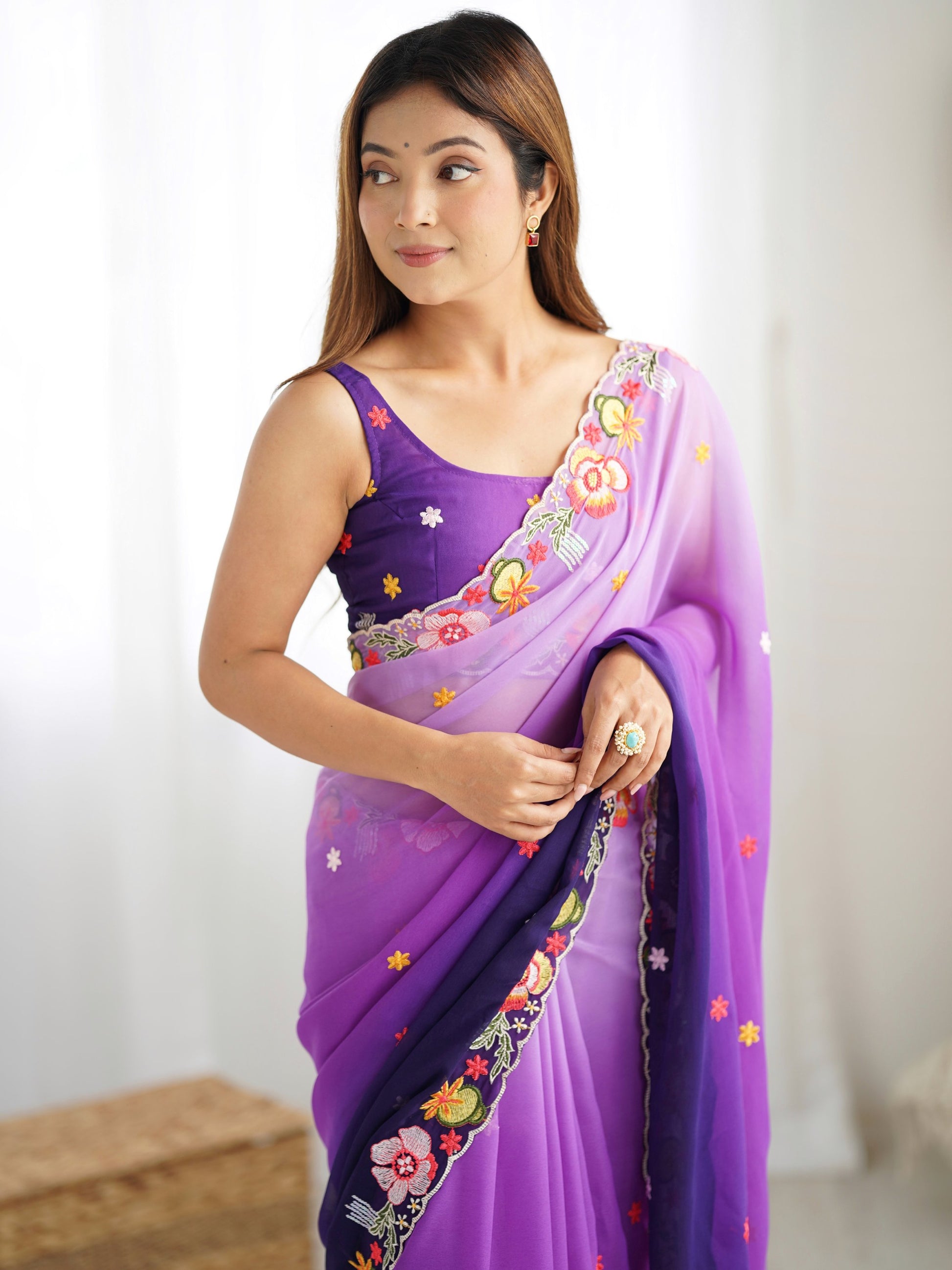 Amazing Purple Thread Embroidered Georgette Casual Wear Saree