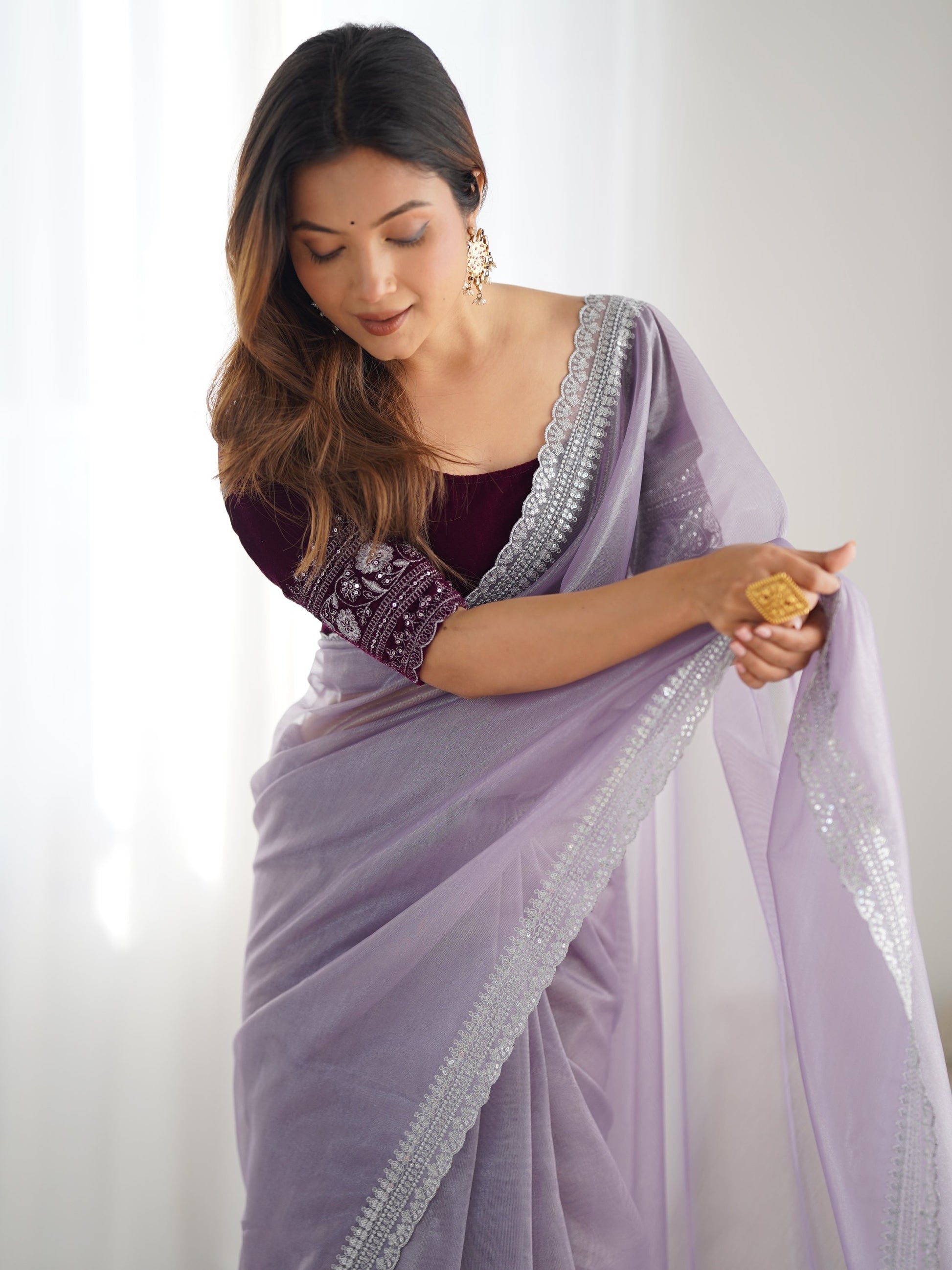 Stunning Lavender Sequins Border Work Net Saree With Blouse