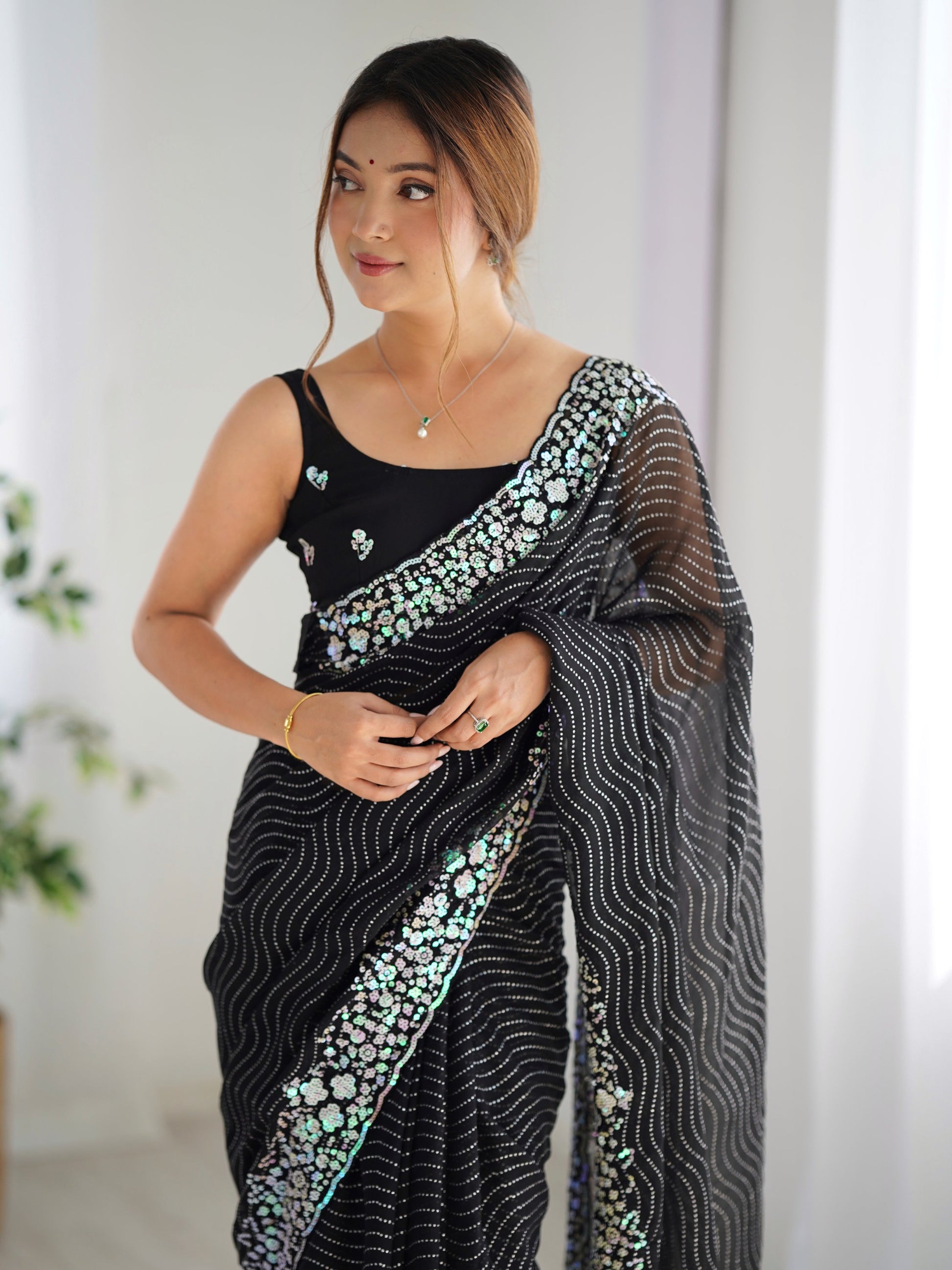 Eye-Catching Black Sequins Georgette Party Wear Saree With Blouse