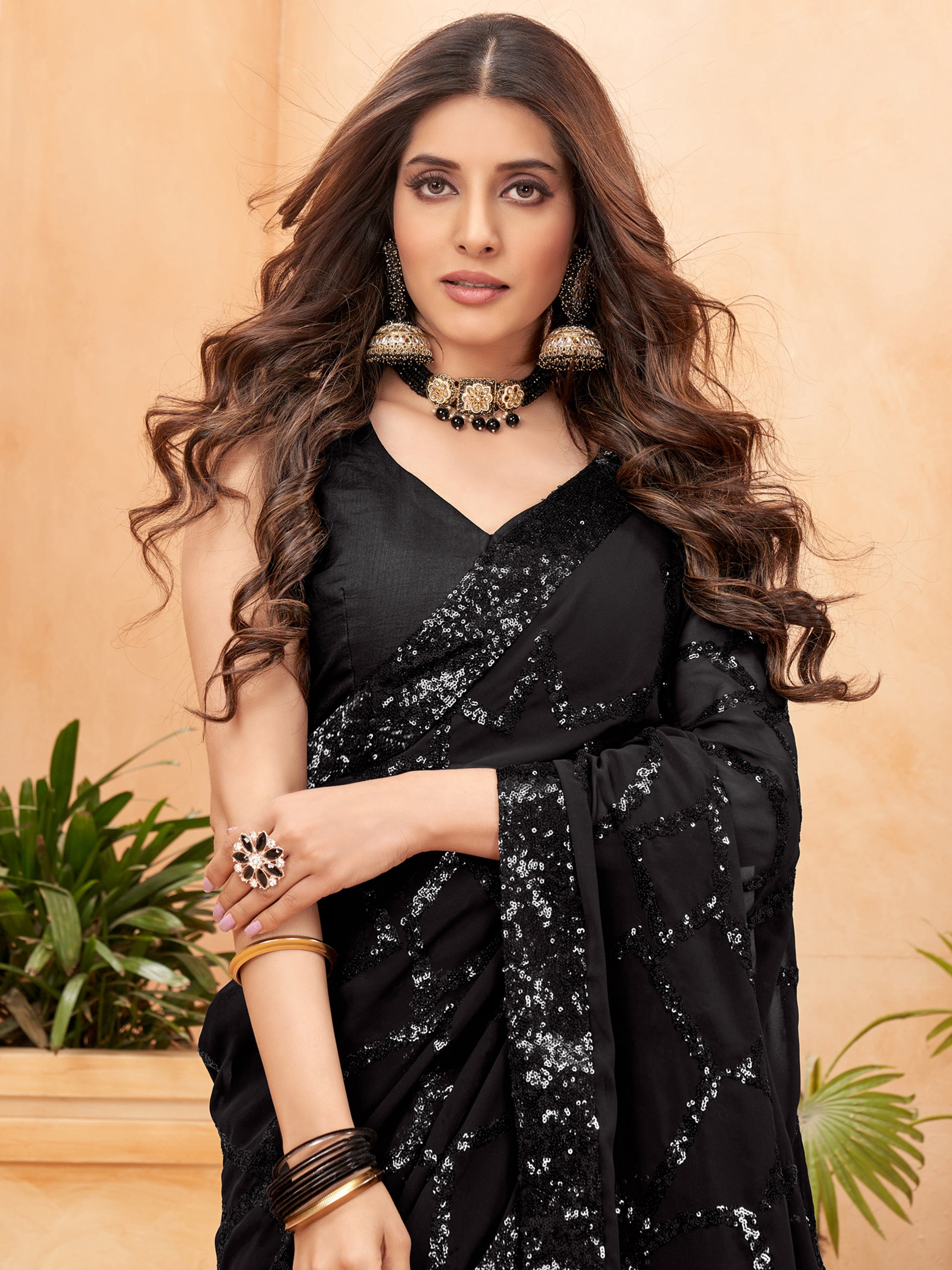 Astonishing Black Sequins Georgette Reception Wear Saree