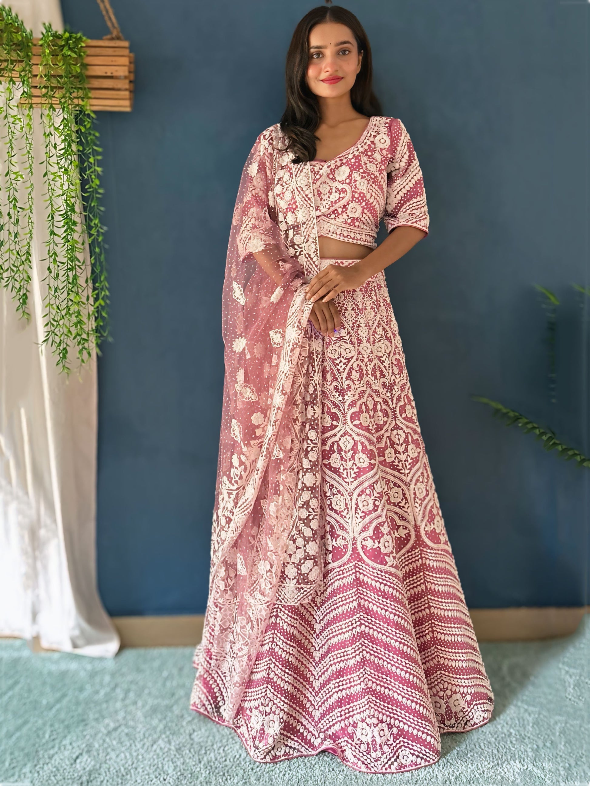 Mesmerizing Pink Beads Work Net Engagement Wear Lehenga Choli