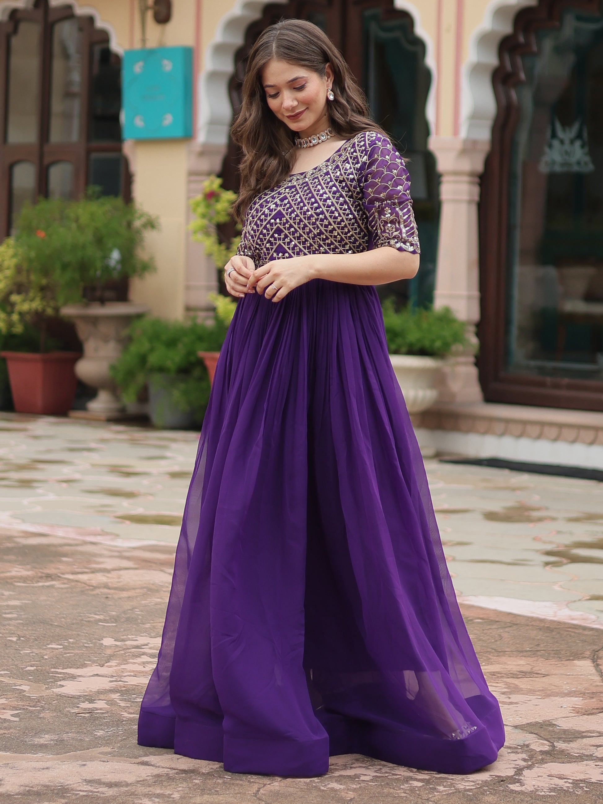 Fabulous Purple Embroidered Georgette Reception Wear Gown