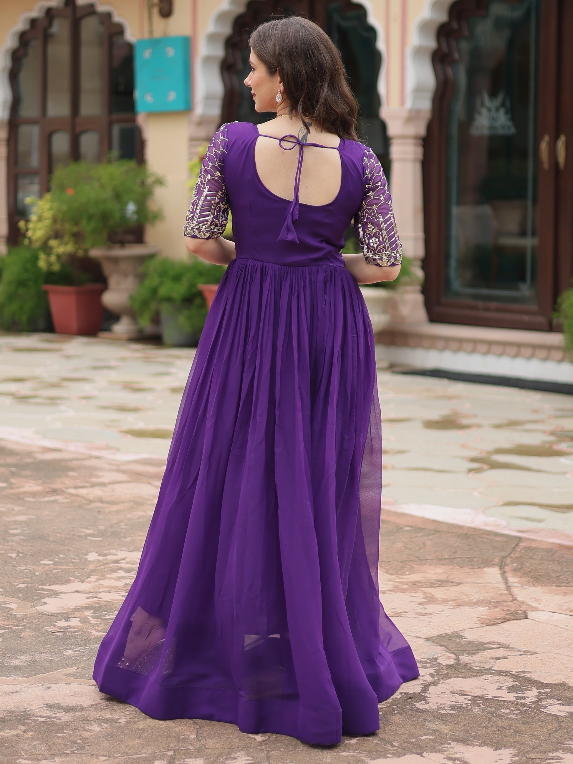 Fabulous Purple Embroidered Georgette Reception Wear Gown