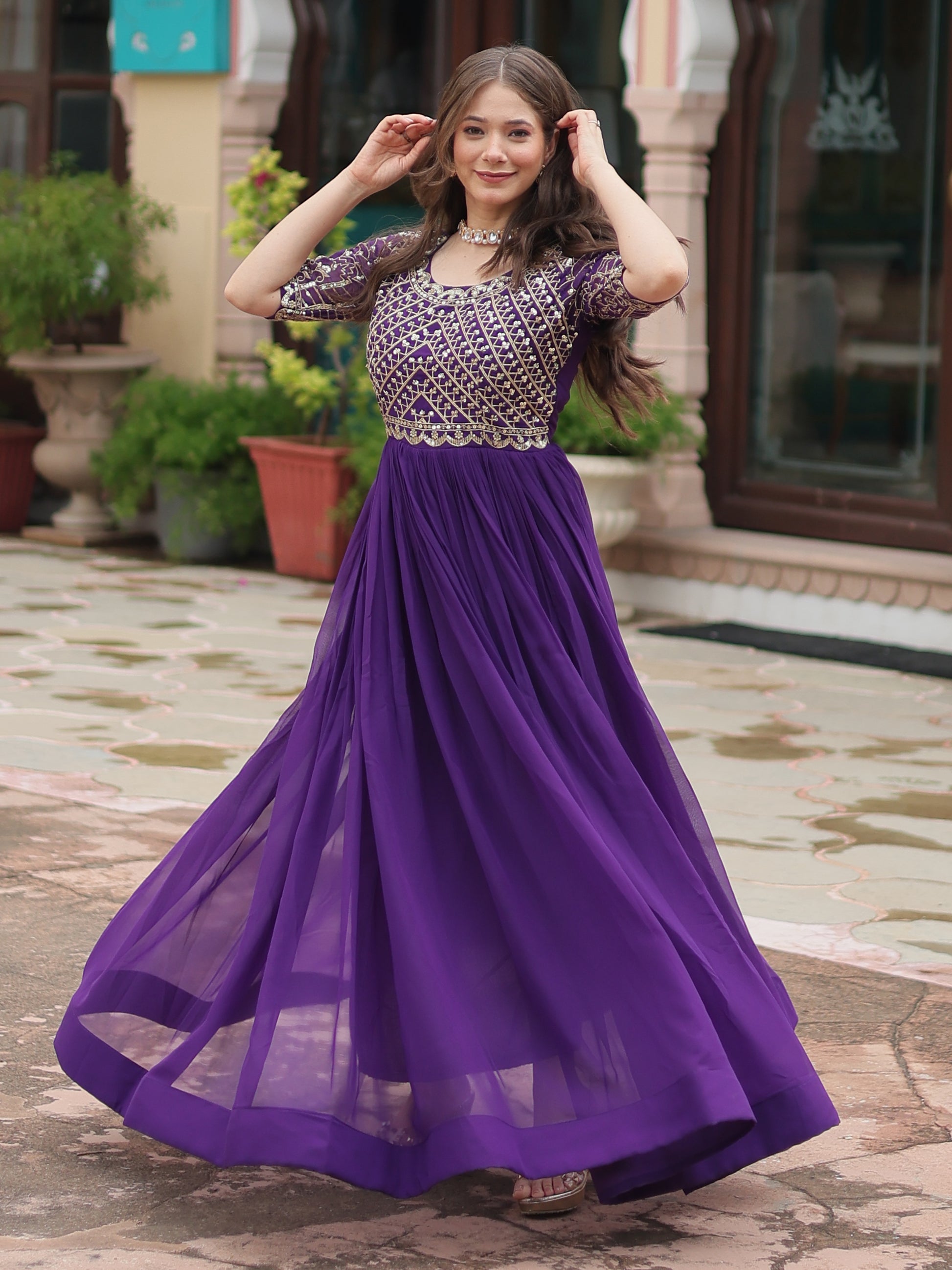 Fabulous Purple Embroidered Georgette Reception Wear Gown
