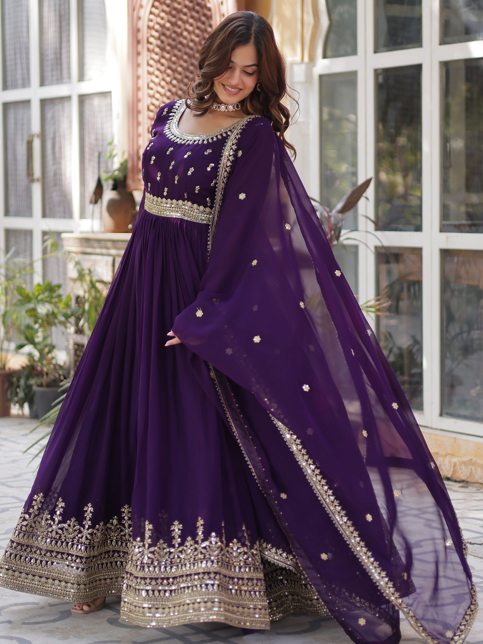 Adorable Purple Zari Embroidered Georgette Festive Wear Gown
