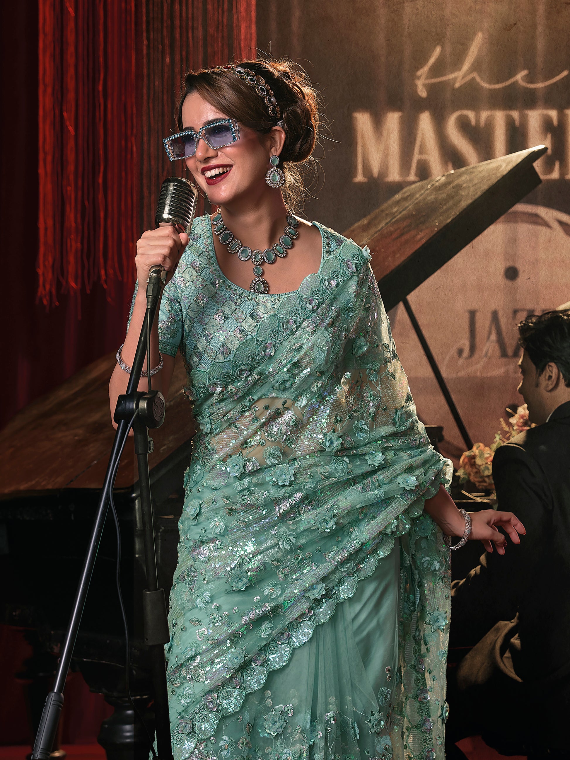 Marvelous Sea Green Sequins Net Designer Saree With Blouse