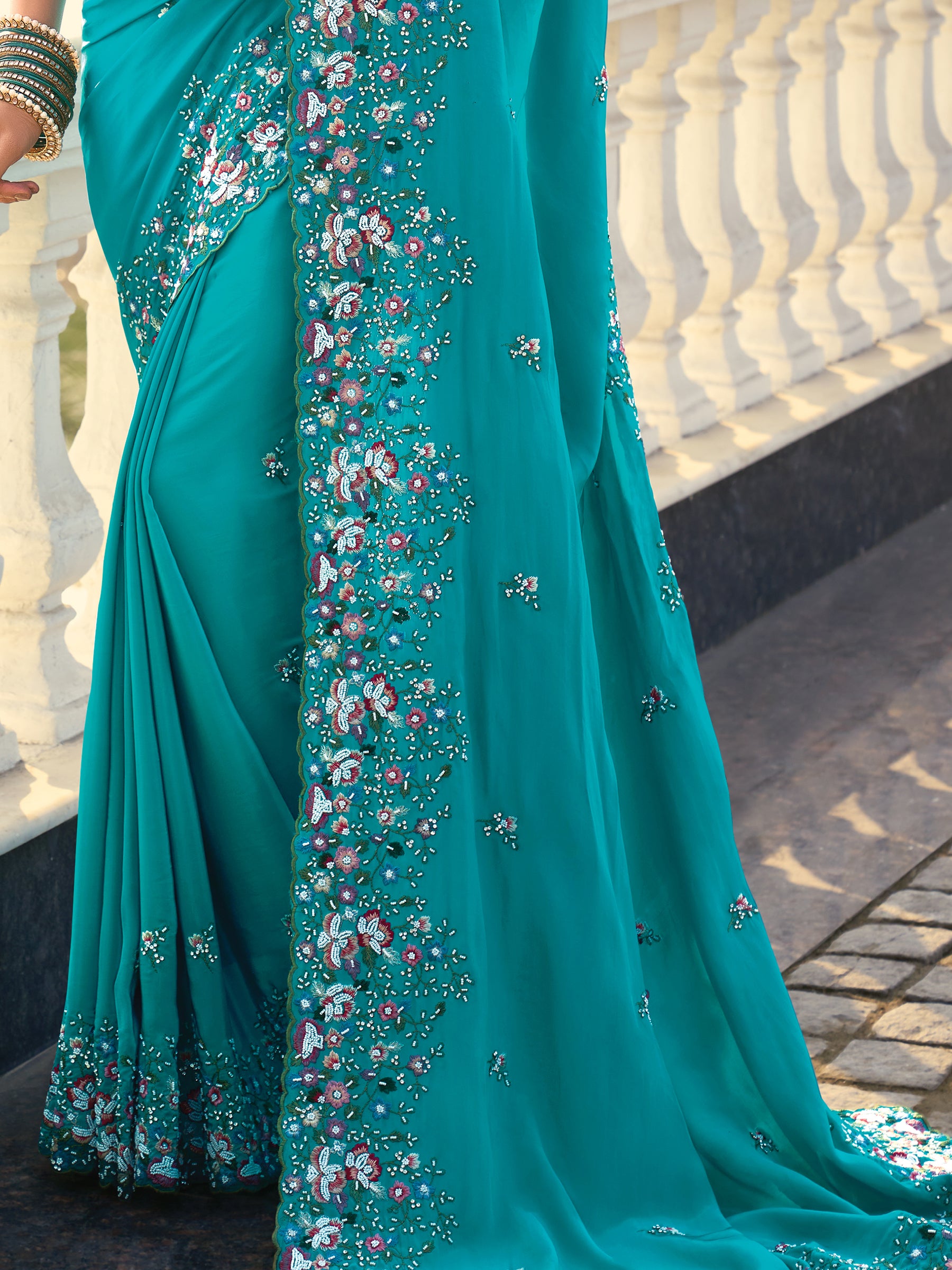 Fascinating Sky Blue Heavy Border Work Crape Silk Traditional Saree