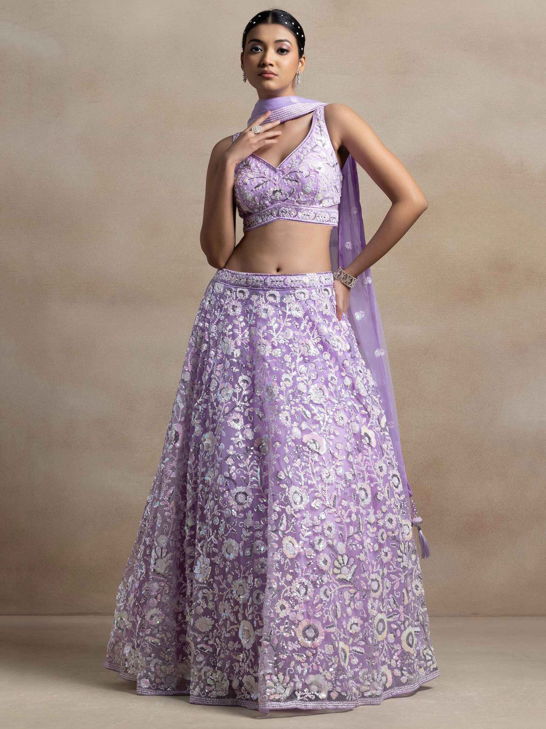 Surprising Lavender Sequins Net Reception Wear Lehenga Choli