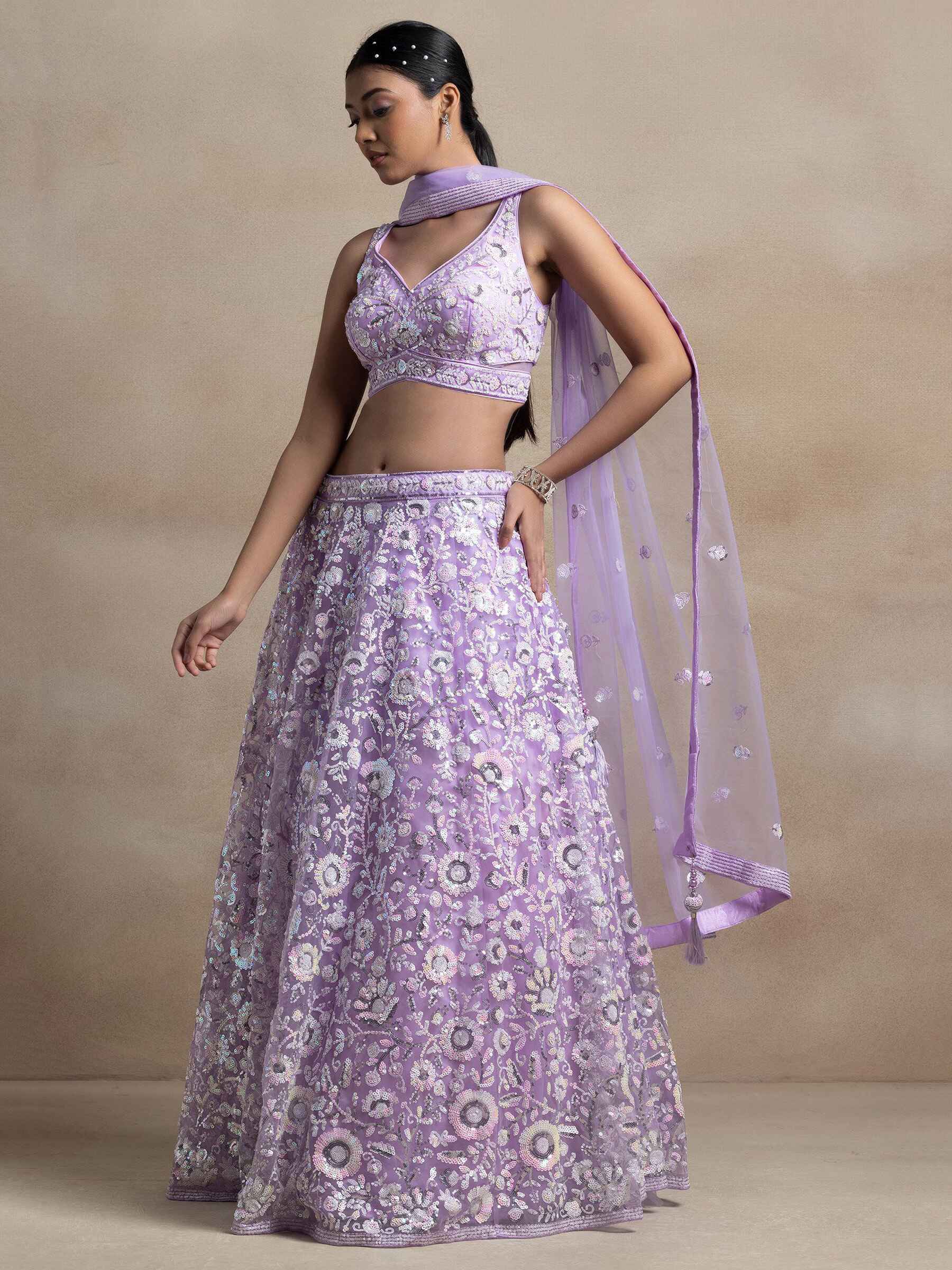 Surprising Lavender Sequins Net Reception Wear Lehenga Choli