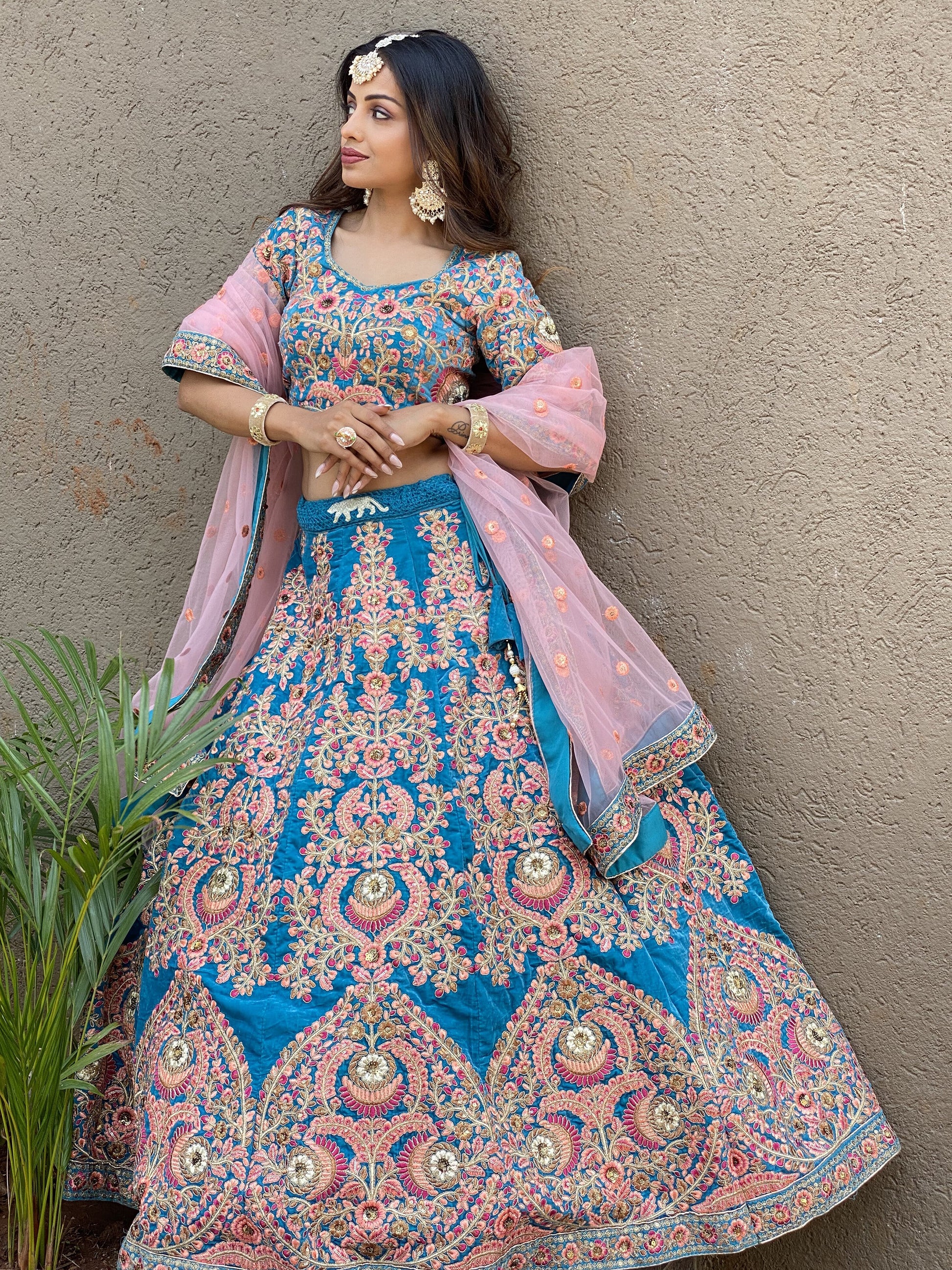 Attractive Blue Embroidered Velvet Wedding Wear Lehenga Choli