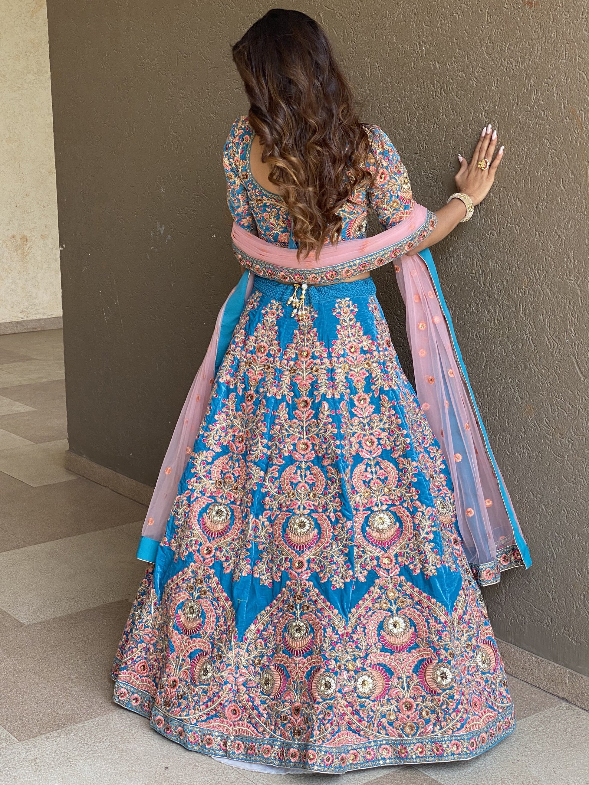 Attractive Blue Embroidered Velvet Wedding Wear Lehenga Choli