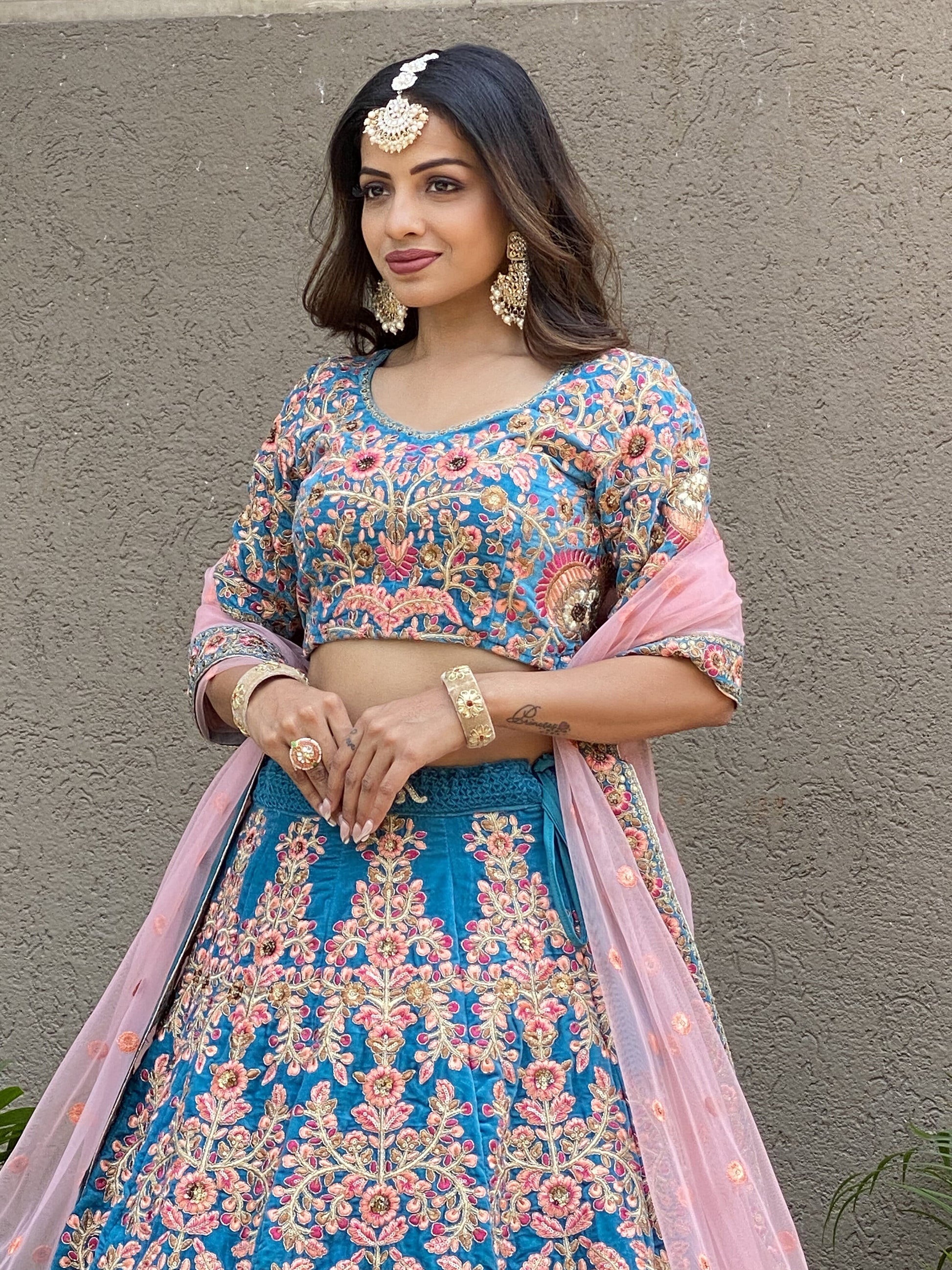 Attractive Blue Embroidered Velvet Wedding Wear Lehenga Choli