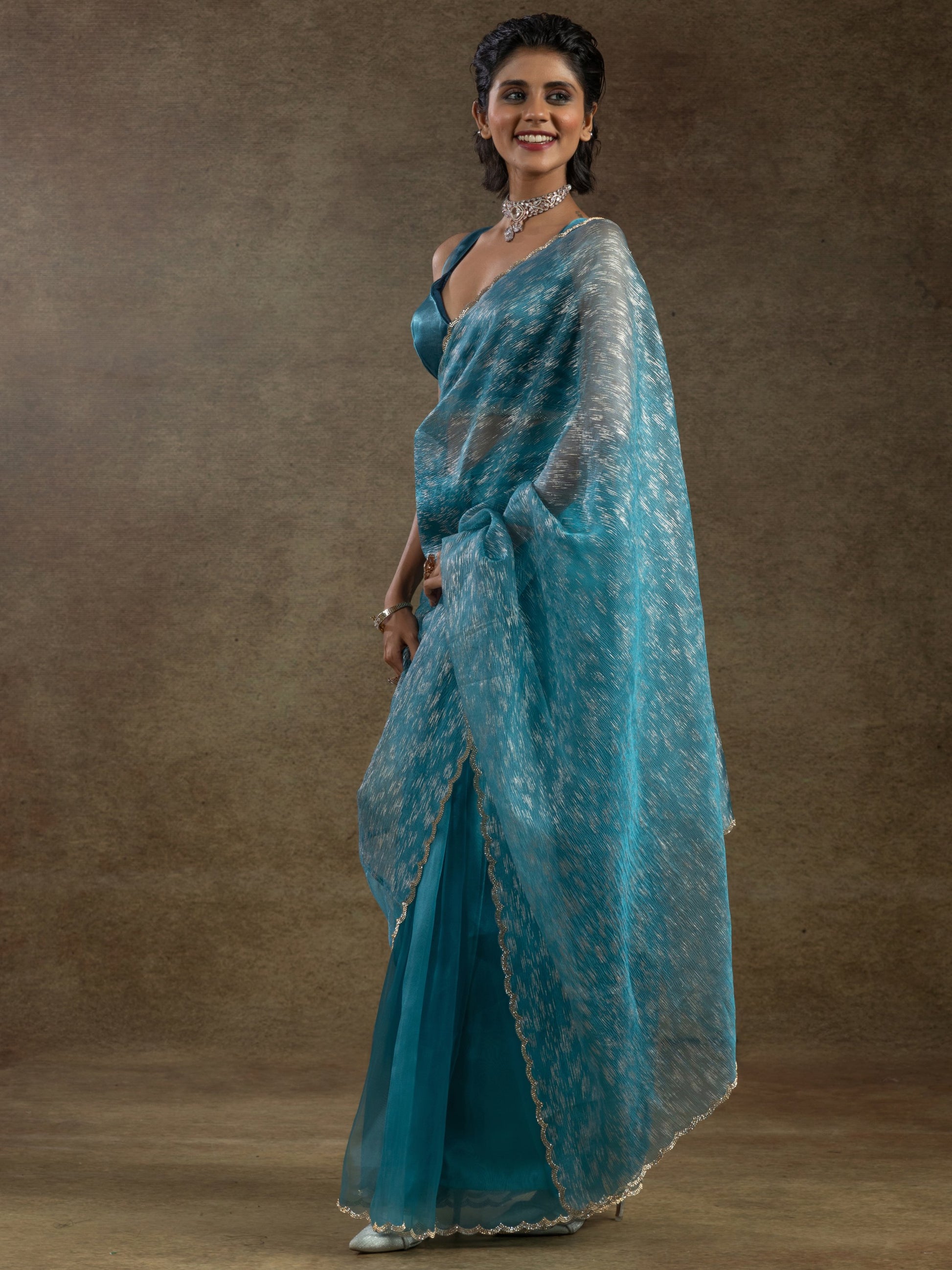 Charming Teal Blue Zari Weaving Organza Reception Wear Pre-Stitched Saree
