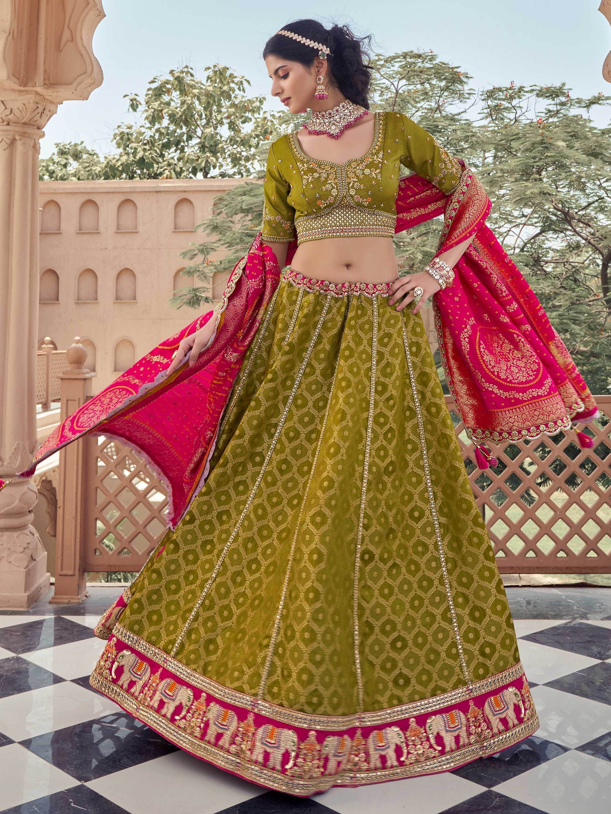 Superb Olive Green Zari Weaving Tissue Function Wear Lehenga Choli With Dupatta