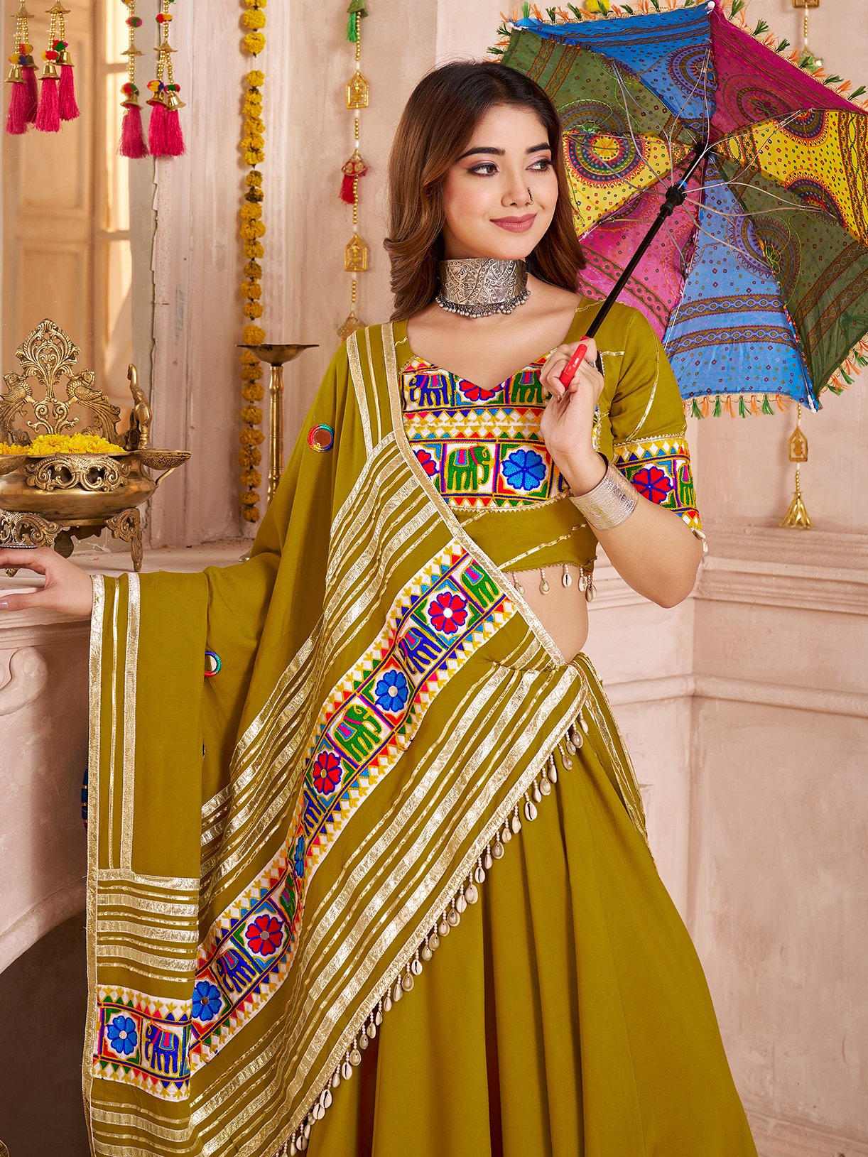 Wonderful Olive Green Lace Work Cotton Navratri Wear Lehenga With Blouse