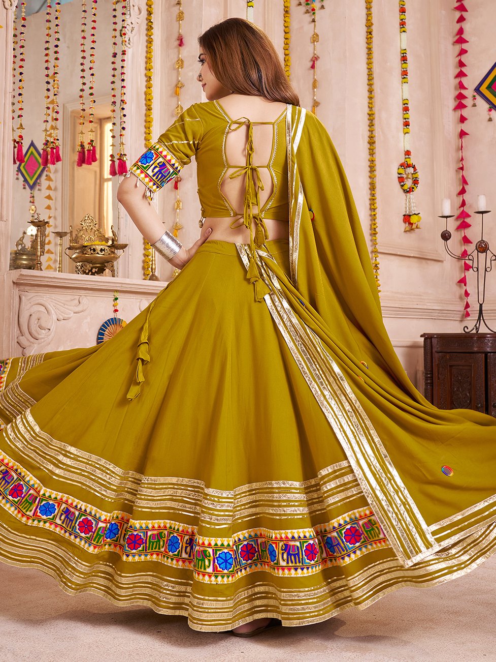 Wonderful Olive Green Lace Work Cotton Navratri Wear Lehenga With Blouse