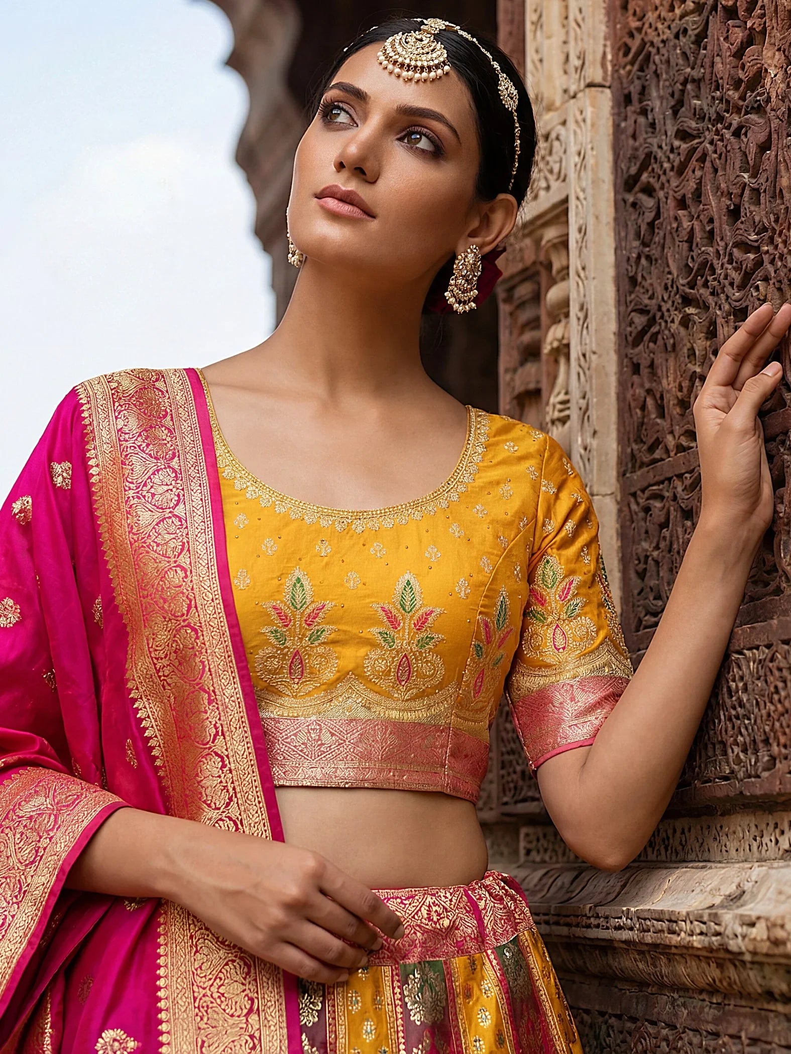 Bewitching Yellow Zari Weaving Banarasi Silk Reception Wear Lehenga Choli
