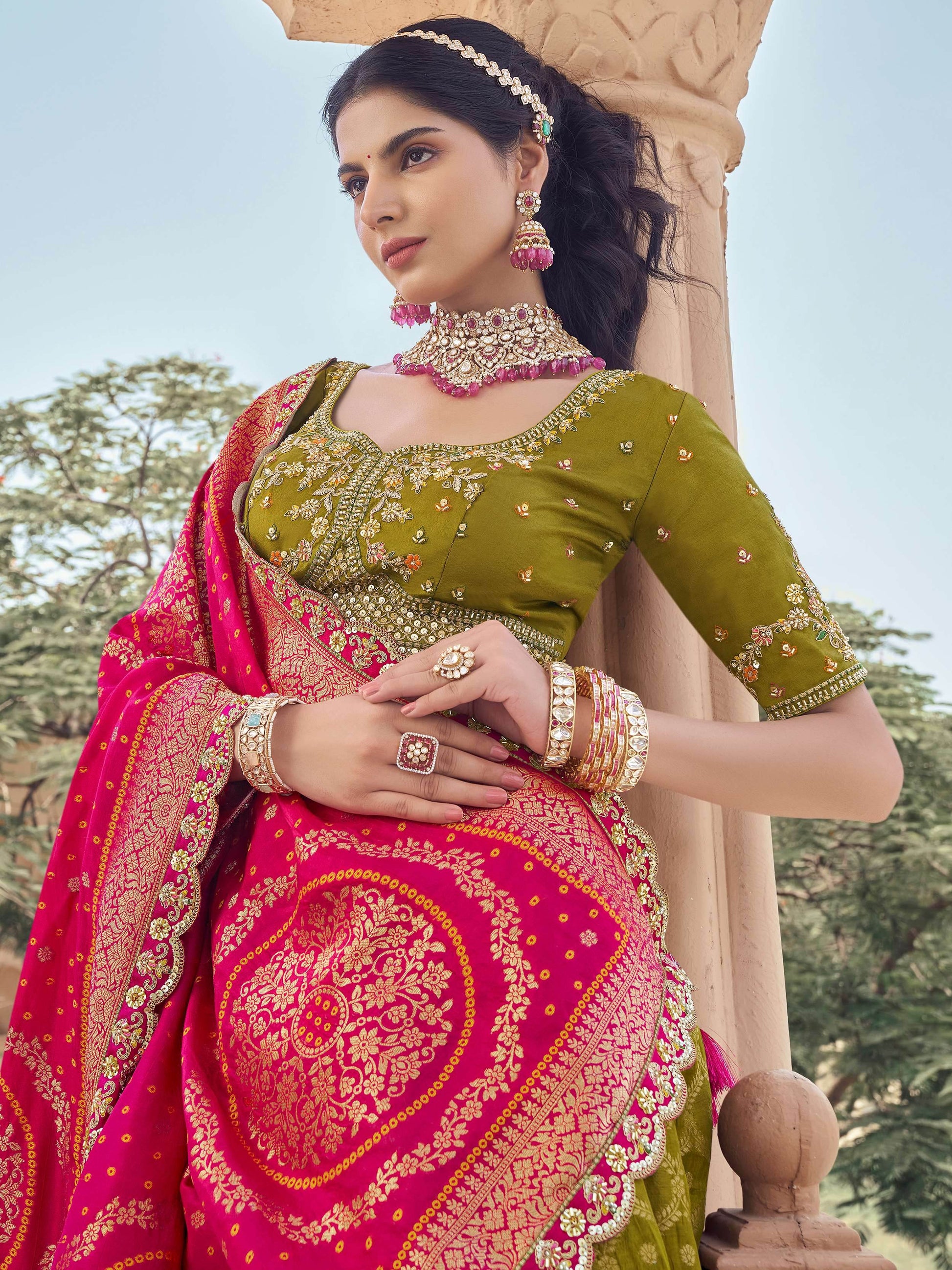 Superb Olive Green Zari Weaving Tissue Function Wear Lehenga Choli With Dupatta