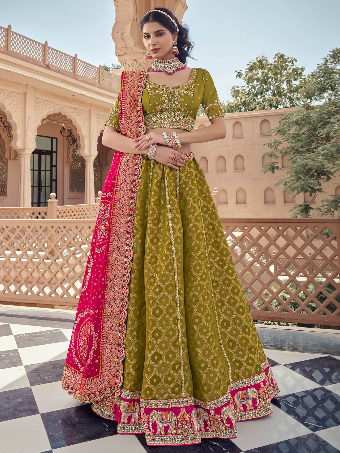 Superb Olive Green Zari Weaving Tissue Function Wear Lehenga Choli With Dupatta