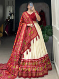 Dazzling Red Patola Printed Tussar Silk Festival Wear Lehenga Choli