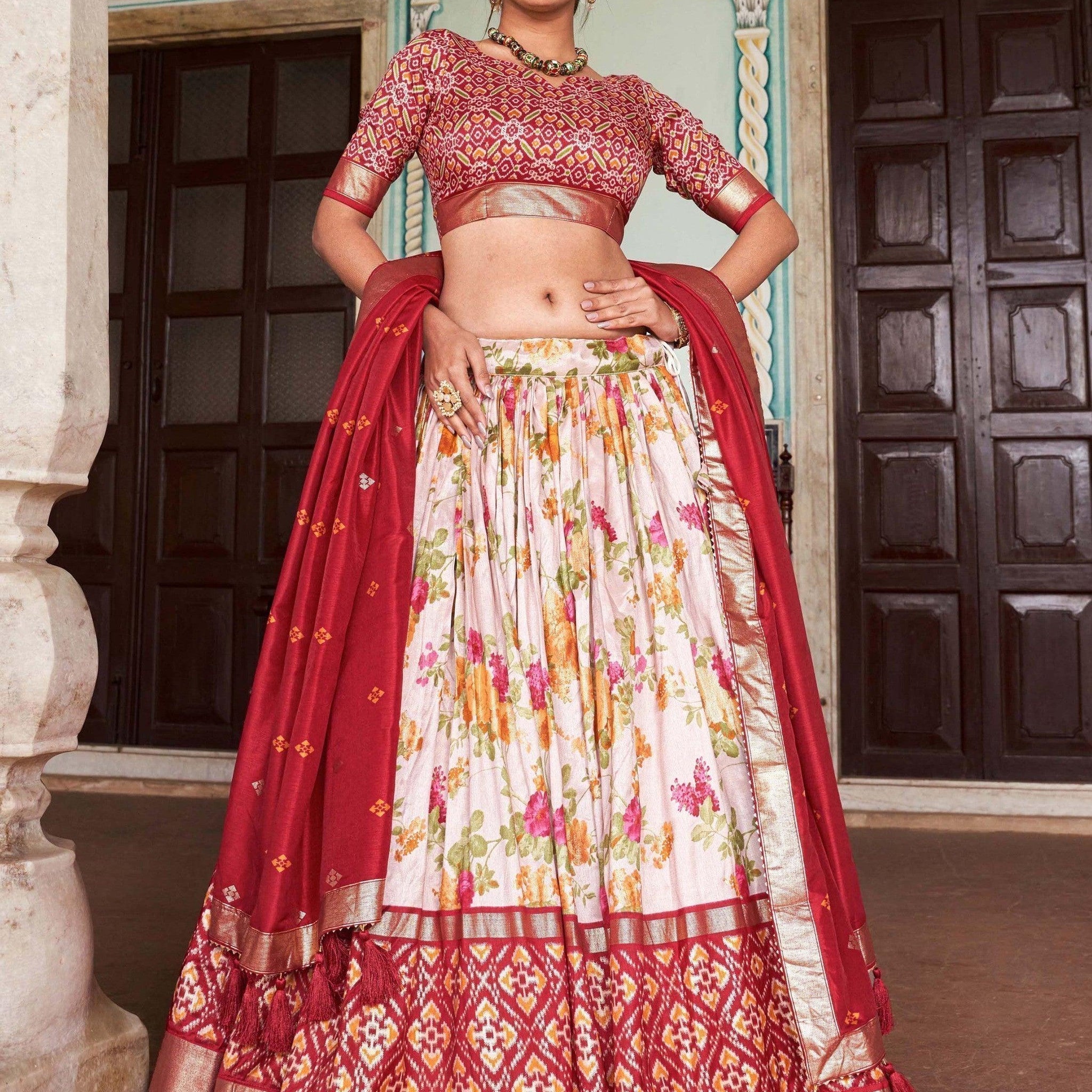 Enchanting Off-White & Red Patola Printed Tussar Silk Lehenga Choli