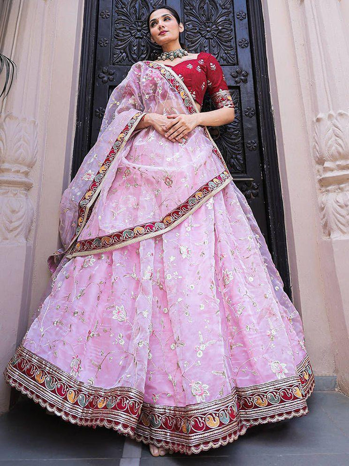 Fabulous Light Pink Thread Embroidery Organza Lehenga With Red Choli