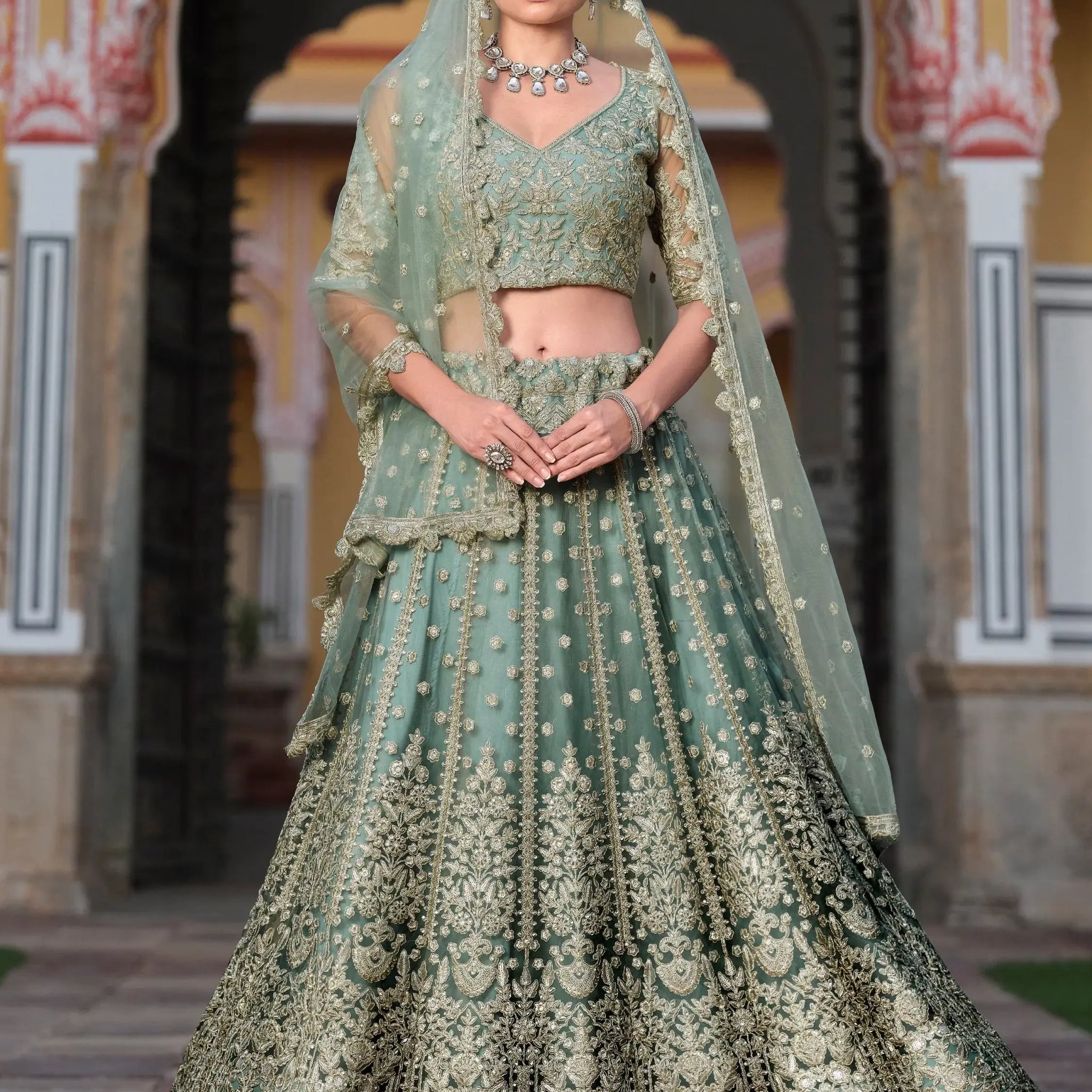 Wonderful Pista Green Embroidered Net Engagement Wear Lehenga Choli