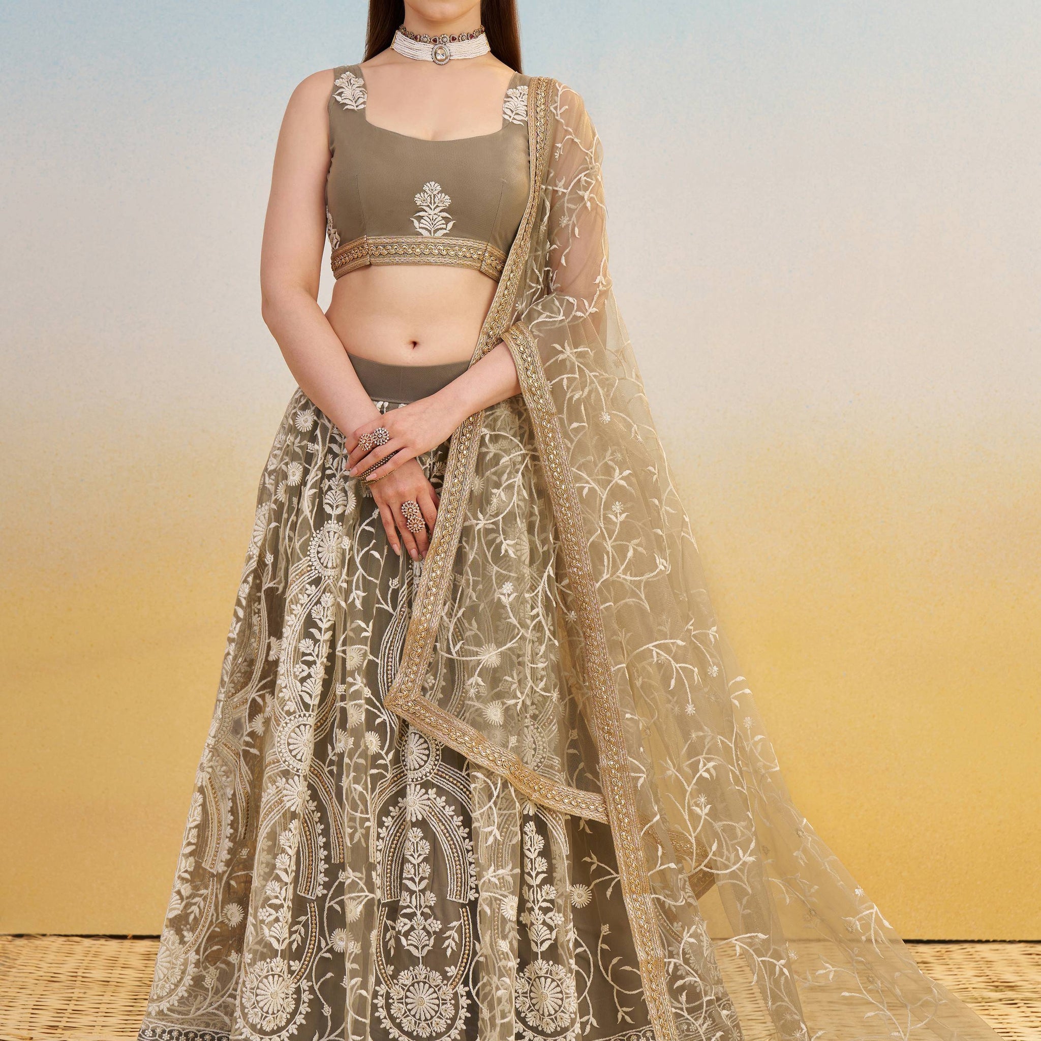 Elegant Brown Embroidered Net Wedding Wear Lehenga Choli With Dupatta