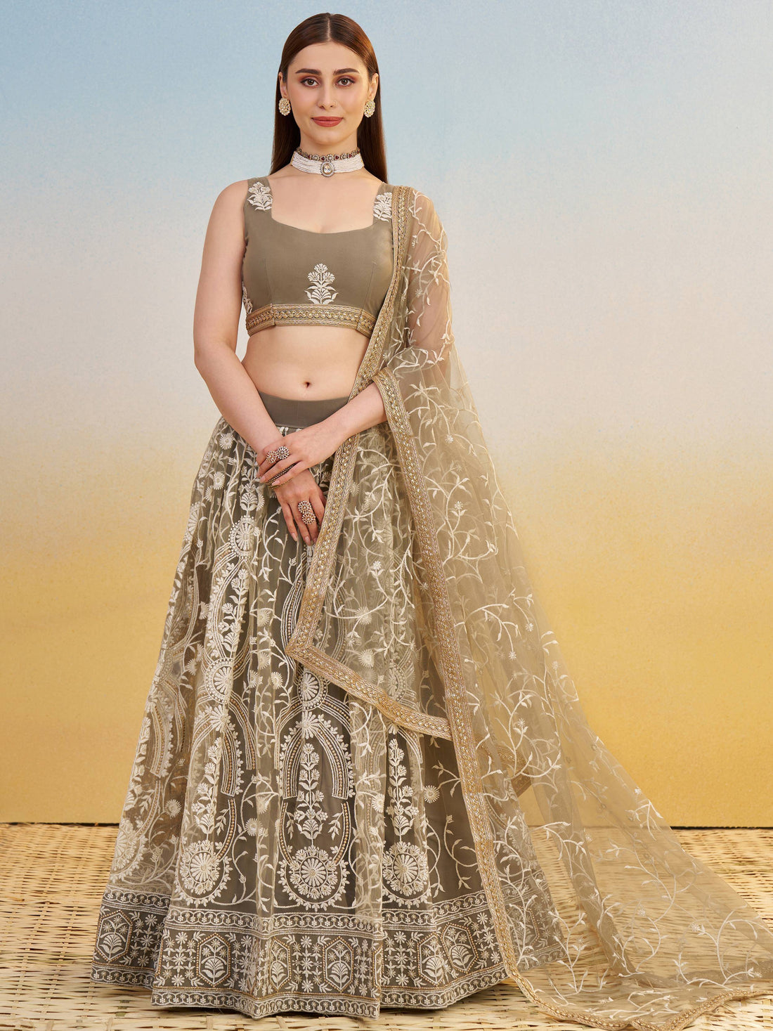 Elegant Brown Embroidered Net Wedding Wear Lehenga Choli With Dupatta