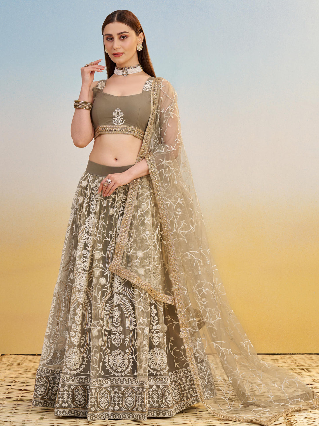 Elegant Brown Embroidered Net Wedding Wear Lehenga Choli With Dupatta