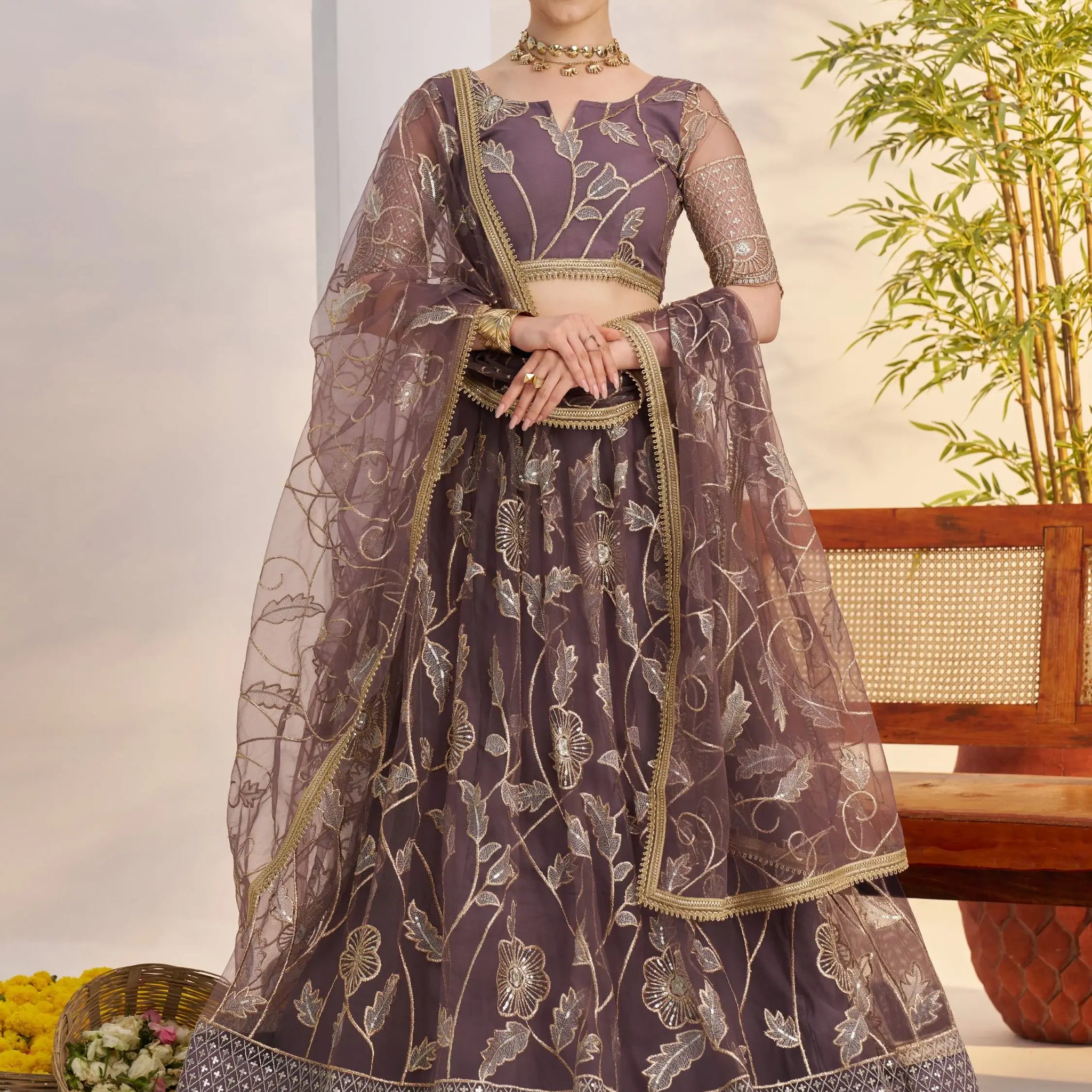 Attractive Mauve Thread Embroidery Net Reception Wear Lehenga With Blouse