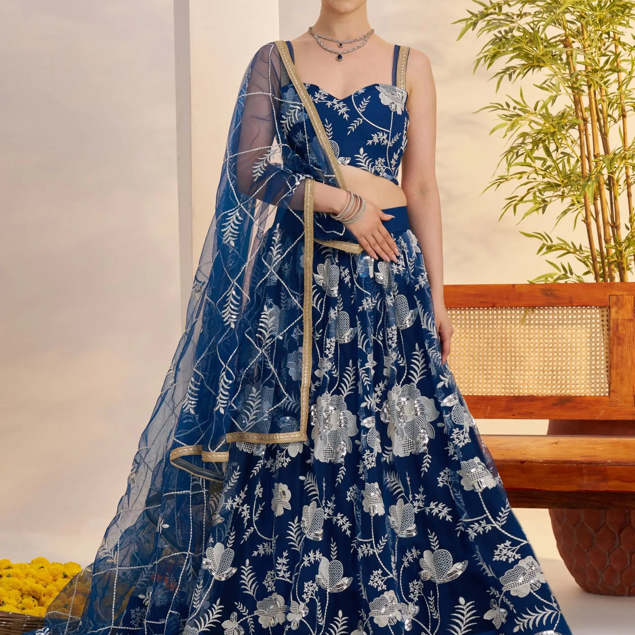 Adoring Teal Blue Floral Embroidery Net Engagement Wear Lehenga Choli